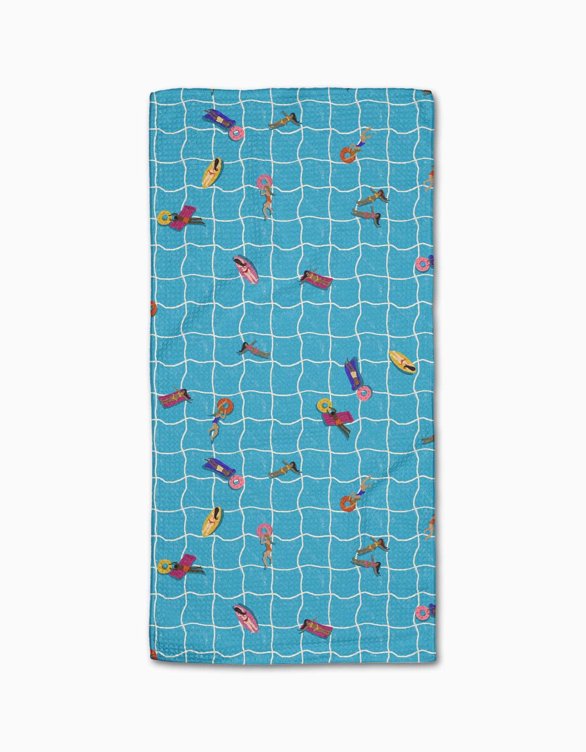 The At The Pool beach towel by Geometry features a rectangular blue Geoweave fabric with a white grid and colorful illustrations of people swimming and relaxing on pool floats.