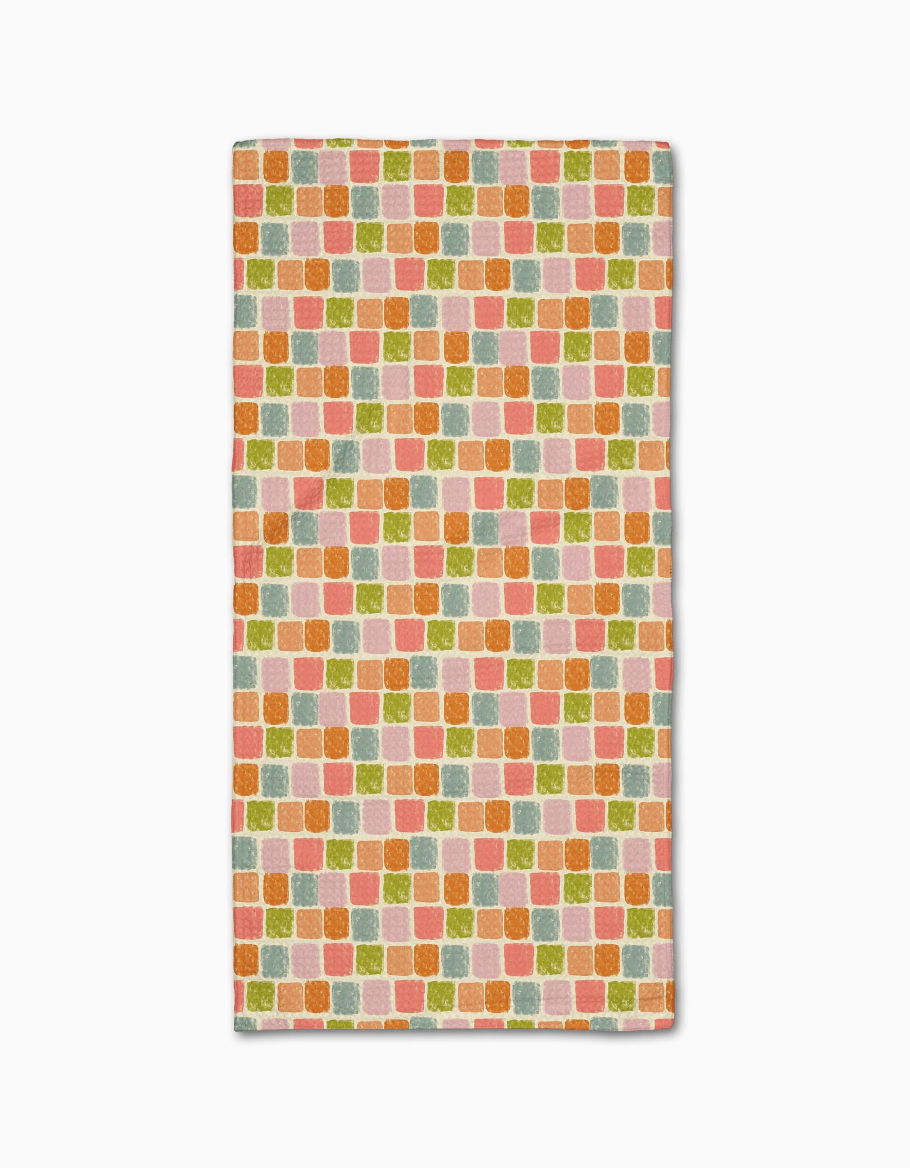 The Geometry Beachy Tile bar towel is made from Geoweave fabric and features a repeating pattern of small, colorful squares in orange, pink, green, and yellow on a light background.