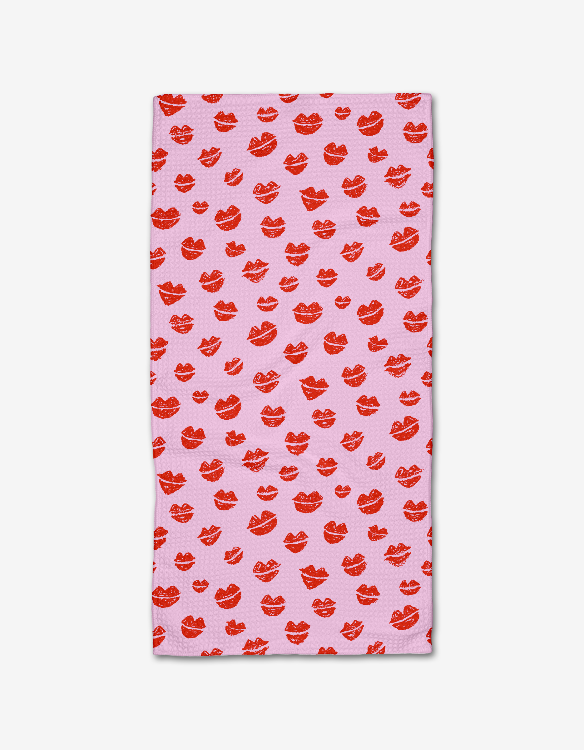 The Kayla Ann Blowing Kisses Bar Towel features a rectangular pink Geoweave fabric design with red lipstick kiss prints scattered across the surface, shown on a white background.
