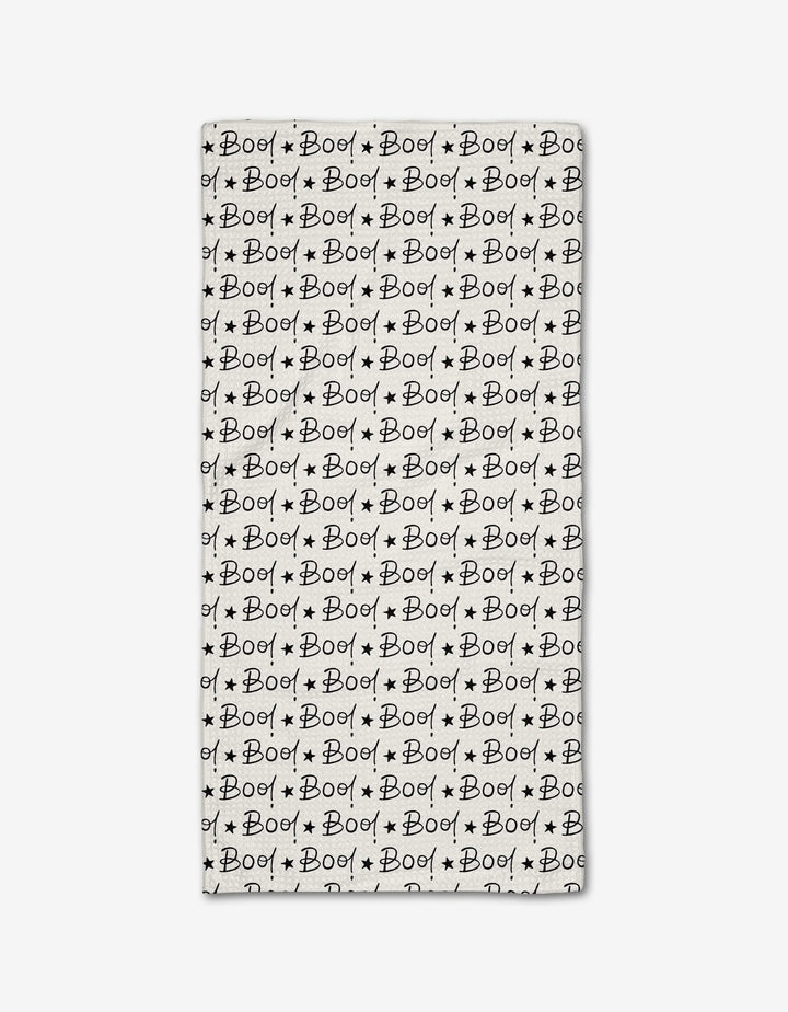 The Boo to You Bar Towel by Hufton Studio is a rectangular white towel made from recycled materials, featuring a repeating black “Boo!” text pattern with small stars for a playful, spooky Halloween design.