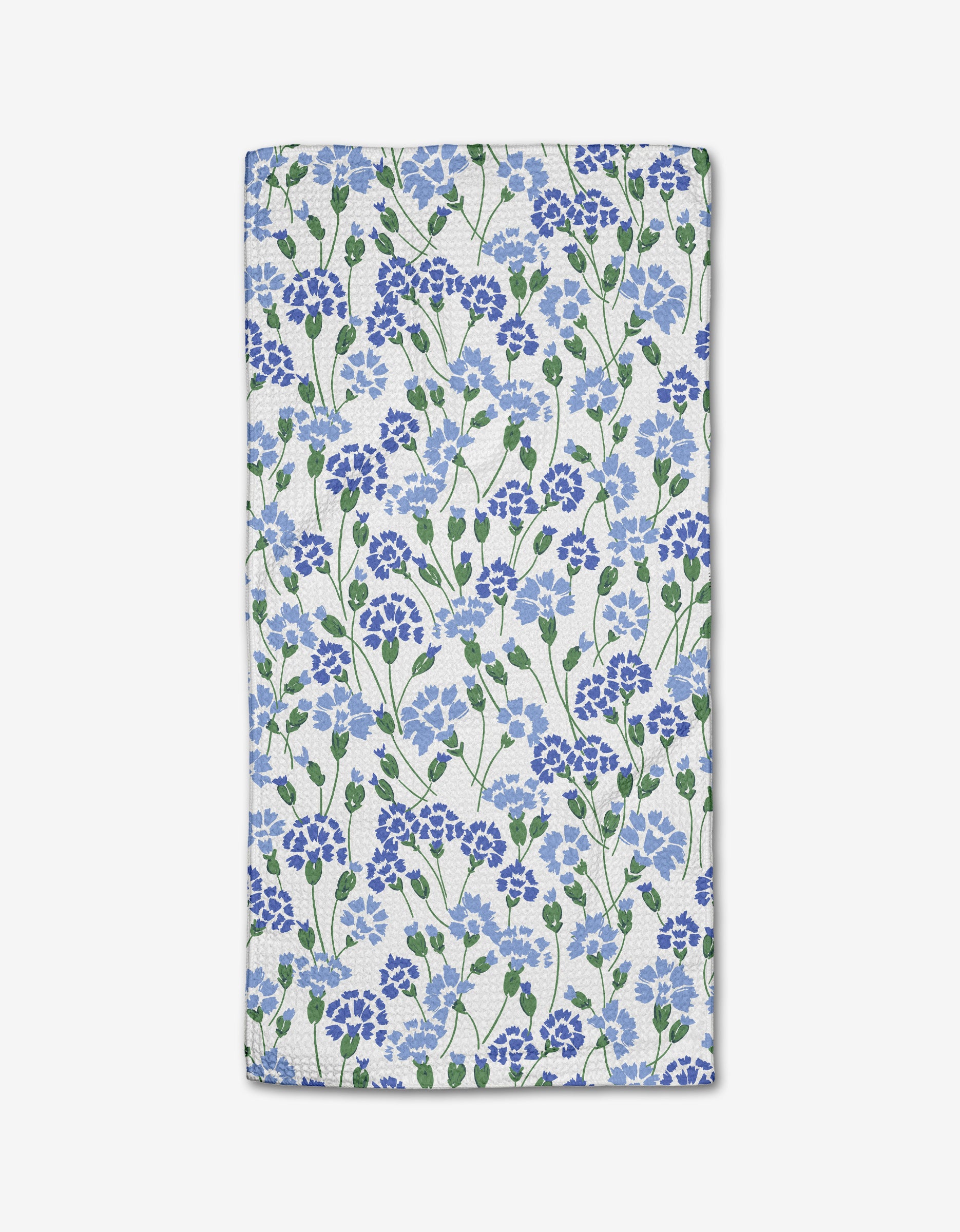 The Carnation Fields Bar Towel by Hufton Studio features a dense blue and purple floral pattern with green leaves on white Geoweave fabric.