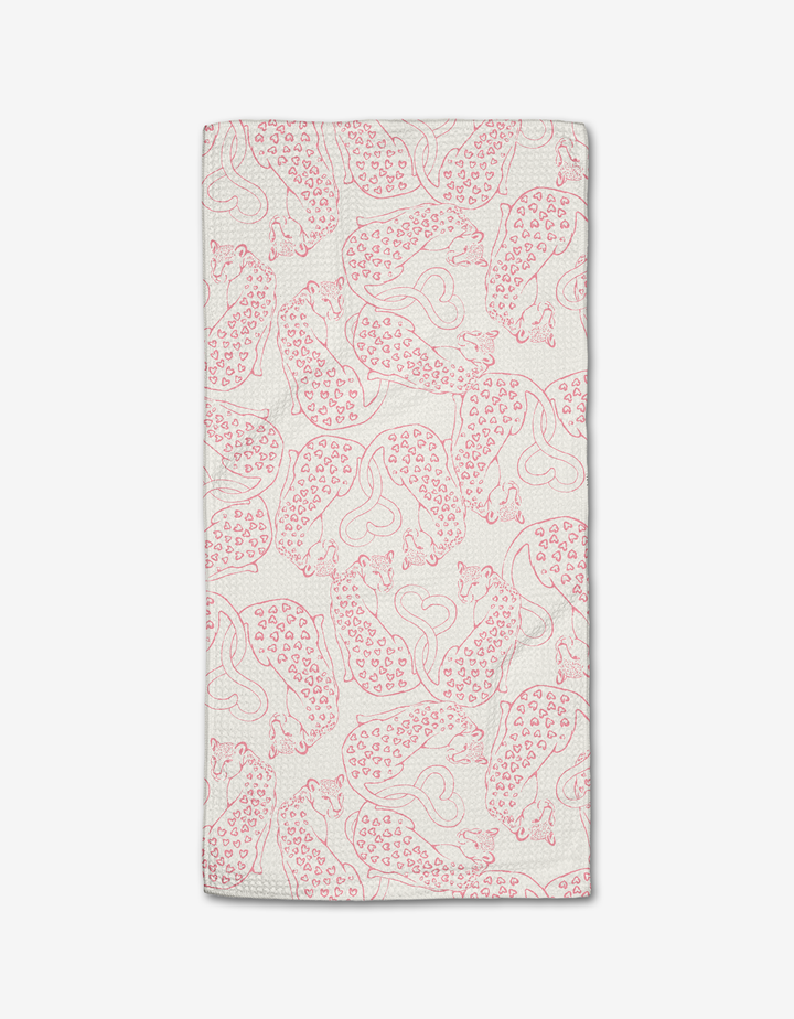 The Cat Lover bar towel by Hufton Studio is a white rectangle made from Geoweave fabric, featuring a repeating pattern of red, stylized cheetahs in various poses with minimalistic outlines.