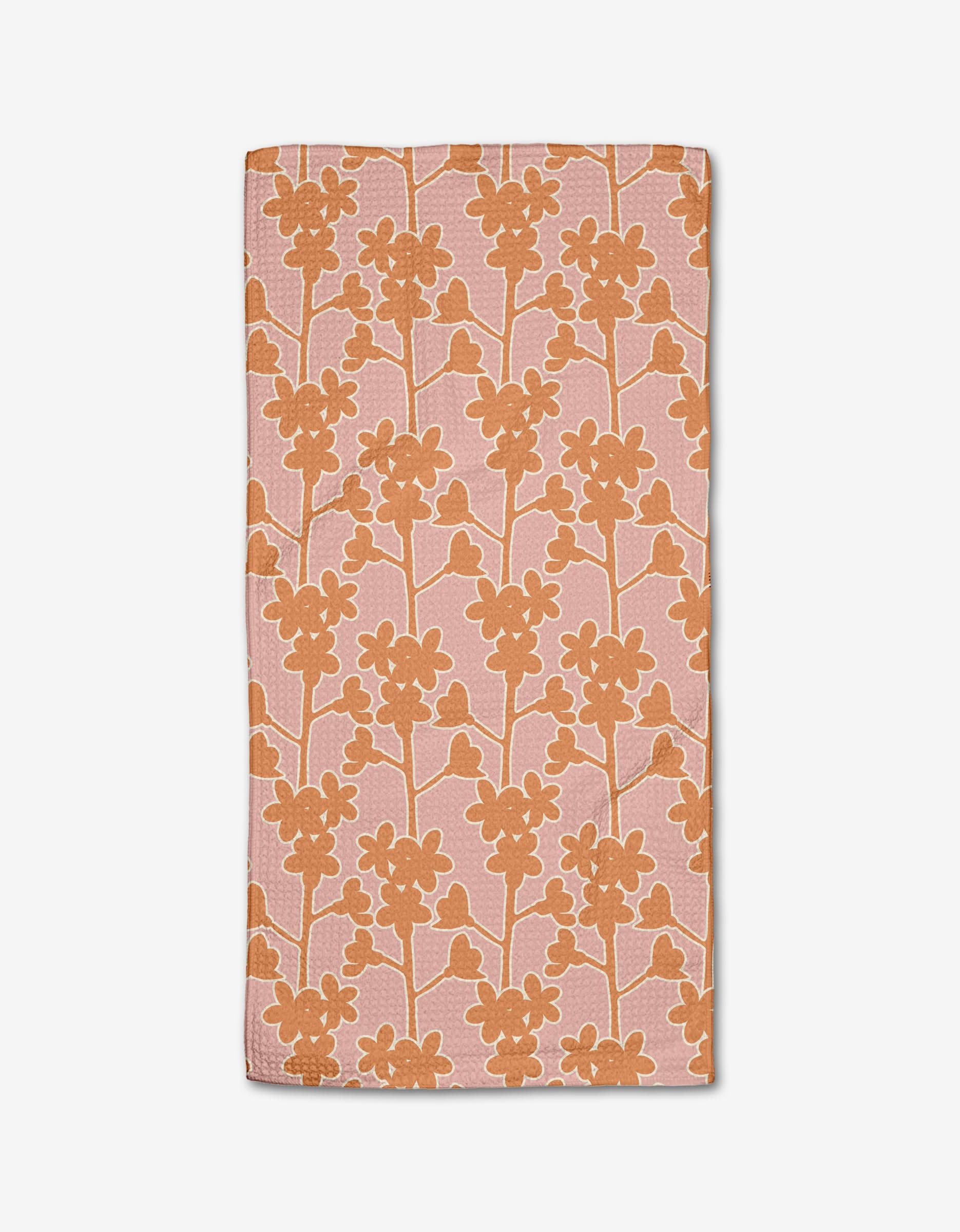 The Cherry Blossom Branches bar towel by Lizzie Clark features a rectangular pink design with an orange floral pattern, made from Geoweave fabric and recycled materials, shown on a white background.