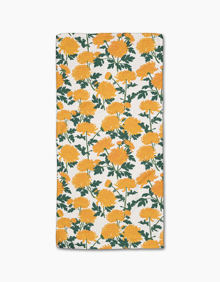 The Chrysanthemum bar towel by Vaishali Design Studio features a rectangular white design with bright yellow chrysanthemum flowers and green leaves, crafted from soft Geoweave fabric for superior absorbency and durability.