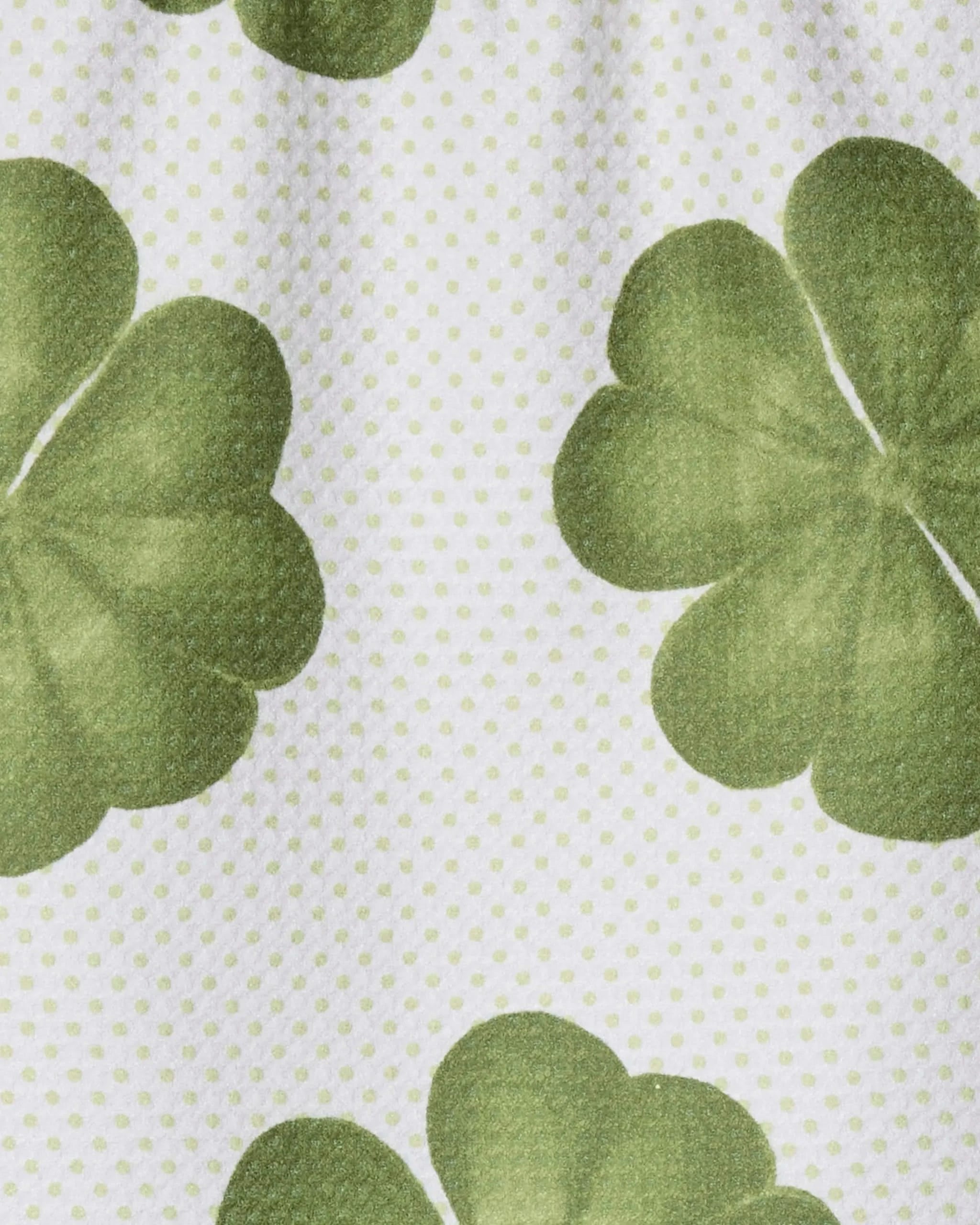 The Green Lattice towel by Geometry features a festive green clover pattern with light green polka dots on white, made from ultra-absorbent recycled materials—perfect for your bar or kitchen.