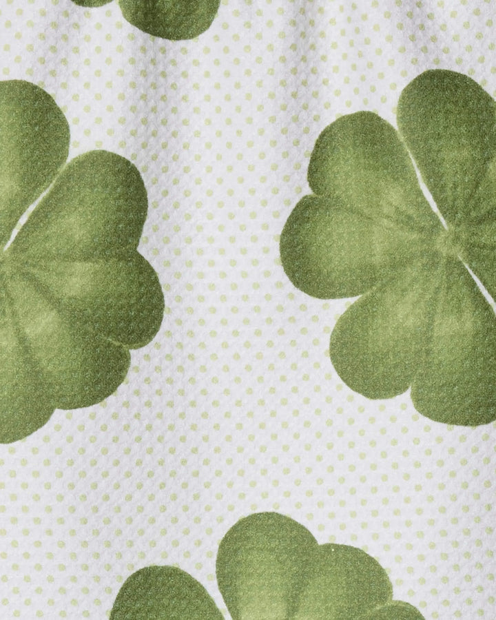 The Green Lattice towel by Geometry features a festive green clover pattern with light green polka dots on white, made from ultra-absorbent recycled materials—perfect for your bar or kitchen.