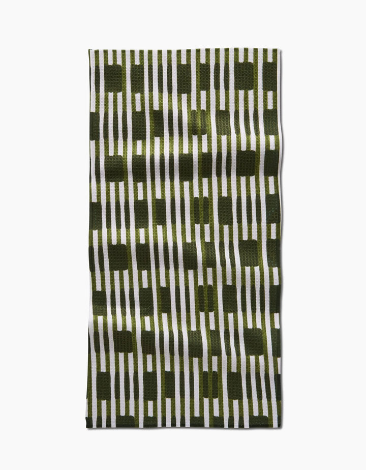 The GEOMETRY Clover Stripe bar towel features a stylish geometric design with vertical olive-green and white stripes and rectangles, crafted from ultra-absorbent recycled materials.