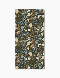 The Danelys Sidron Cottage Meadow Sepia bar towel features a dense floral pattern in cream, blue, brown, pale pink, and green on a dark background, crafted from Geoweave fabric for superior absorbency.
