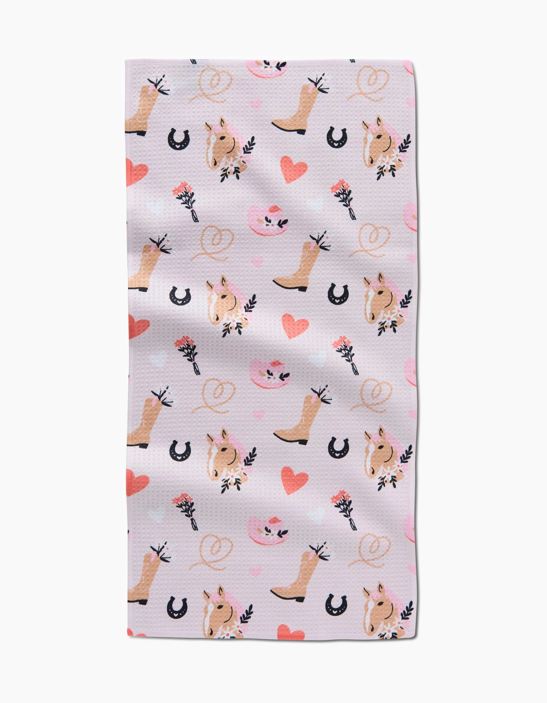 The Cowgirl Love bar towel by Amberleigh Adoff features cowgirl boots, horseshoes, flowers, hearts, pink hats, pretzels, and smiling horse faces—crafted from recycled materials for an eco-friendly touch.