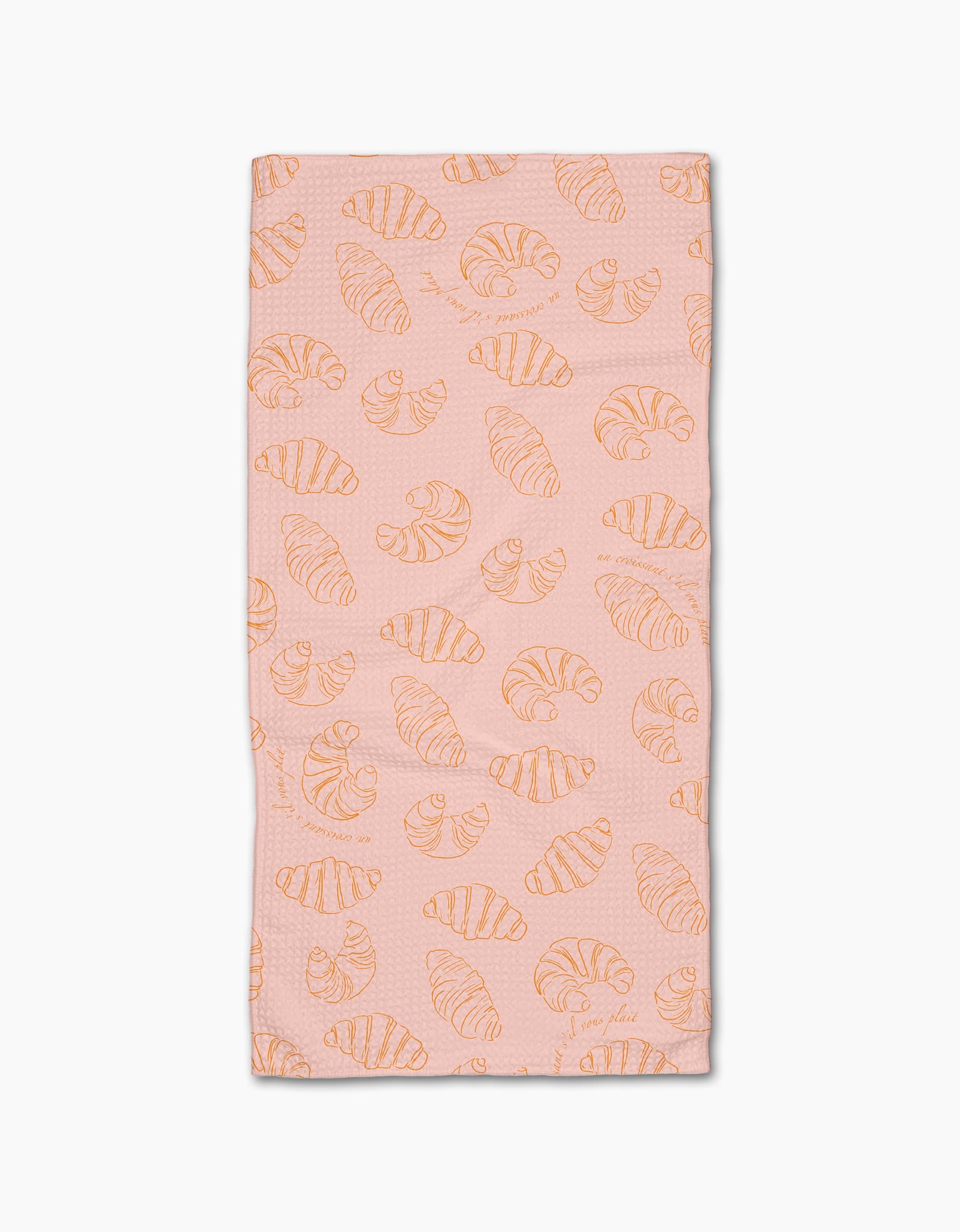 The Croissant Crush towel by Geometry is a pink rectangular bar towel with an all-over orange line-drawn croissant pattern, crafted from durable Geoweave fabric and displayed on a white background.