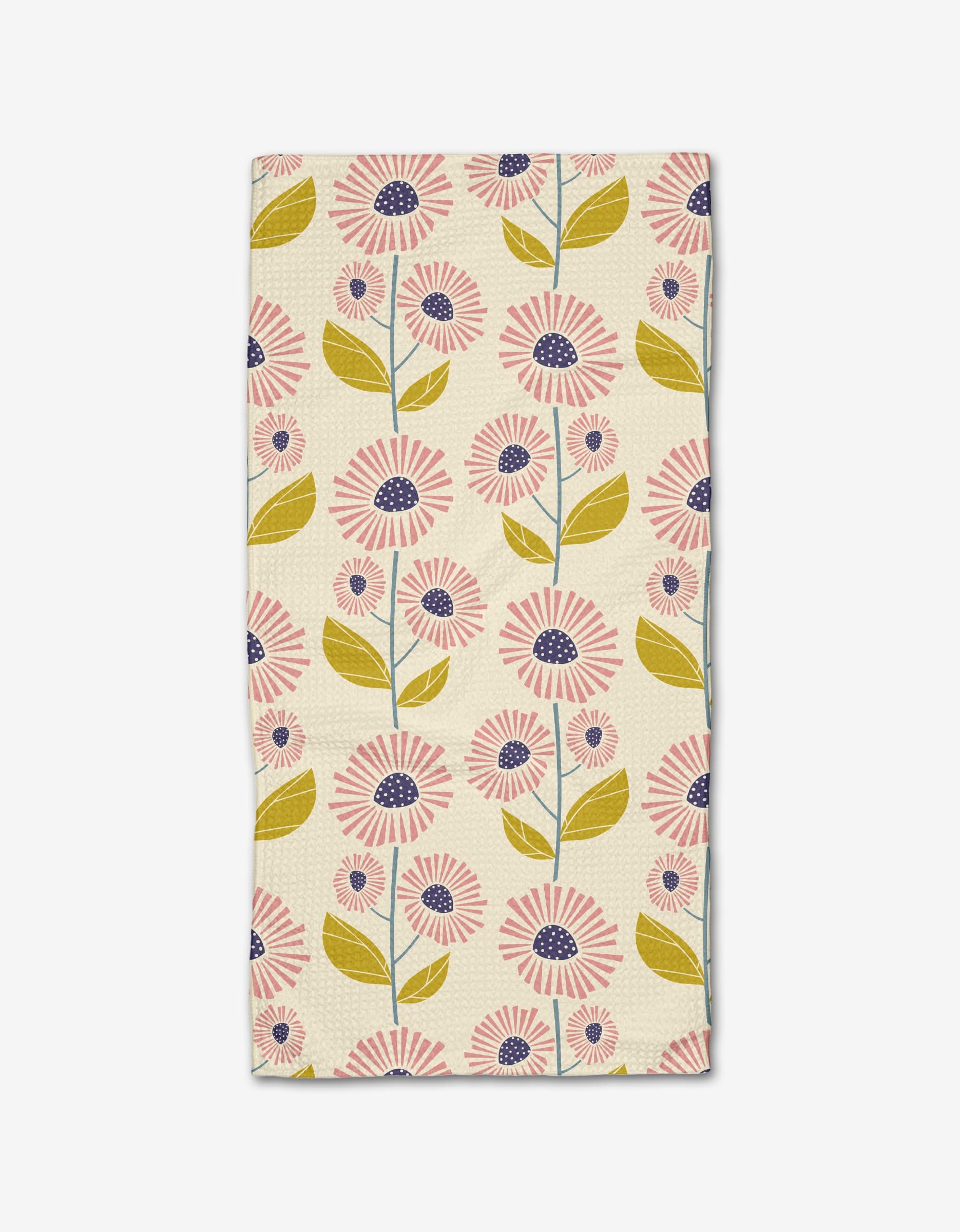 The Daisy Mays bar towel by Lizzie Clark is made from Geoweave fabric and features pink and navy flowers with green leaves and stems in vertical rows on a beige background.