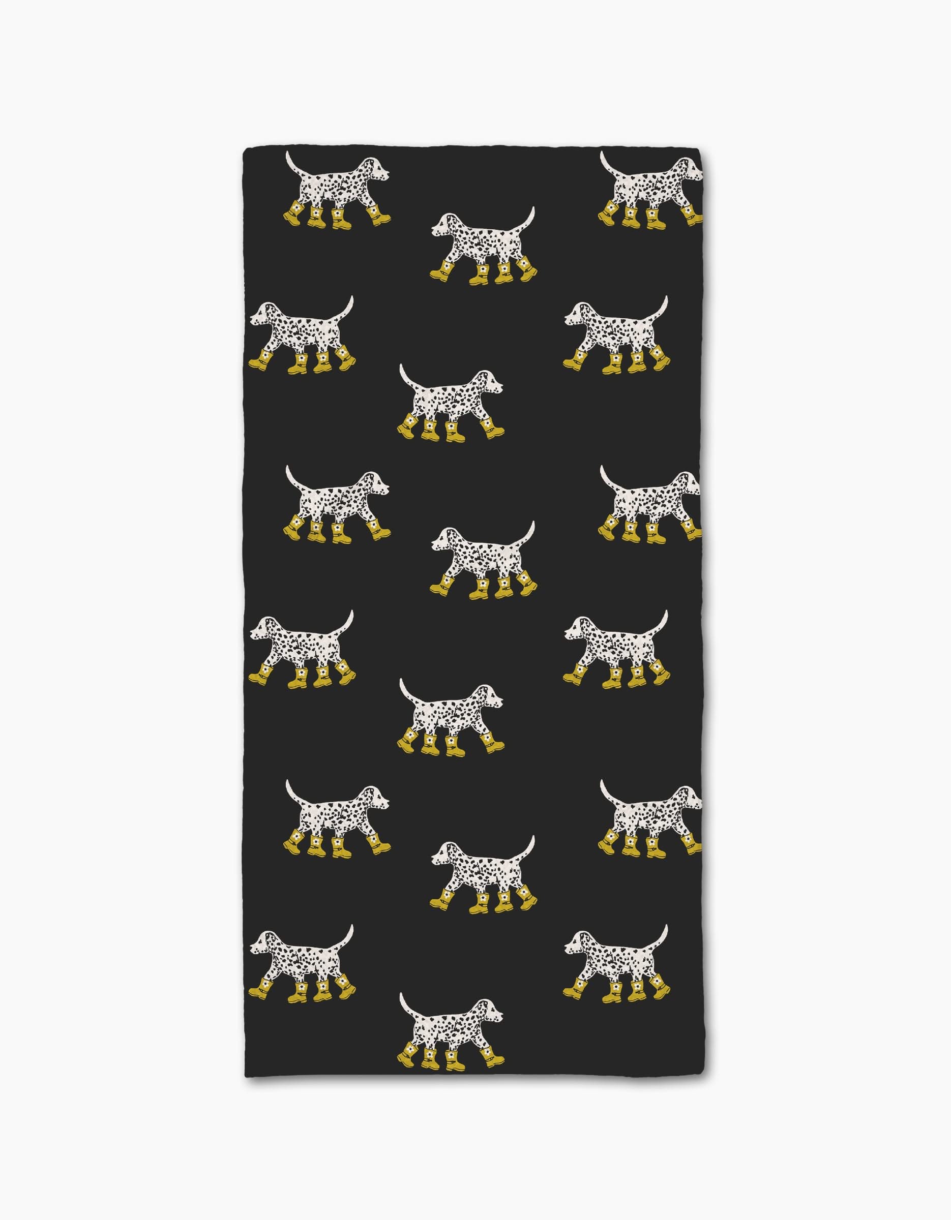 The Geometry Dalmatian In Boots Black bar towel features rows of Dalmatian dogs in yellow boots on a black background. Made from recycled materials, the dogs are evenly spaced in a repeating rectangular pattern.