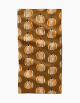 The Dancing Pumpkins bar towel by Lizzie Clark features a brown Geoweave fabric with neat rows of white and orange striped pumpkins with dark stems.