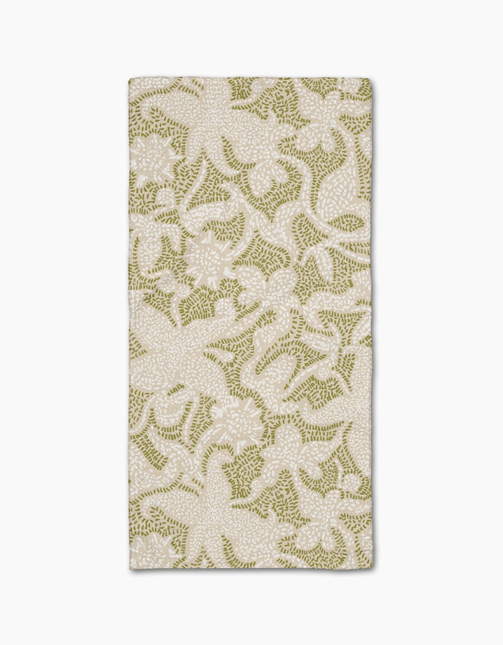 The Geometry Dotted Floral Garden napkin features ultra-absorbent Geoweave fabric with a stylish green and white floral pattern on a light background, perfect for enhancing any table setting.