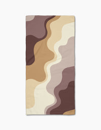 Earthy Waves by Gerdadzy is a rectangular bar towel featuring a wavy abstract pattern in brown, beige, cream, and tan tones, shown on a white background.