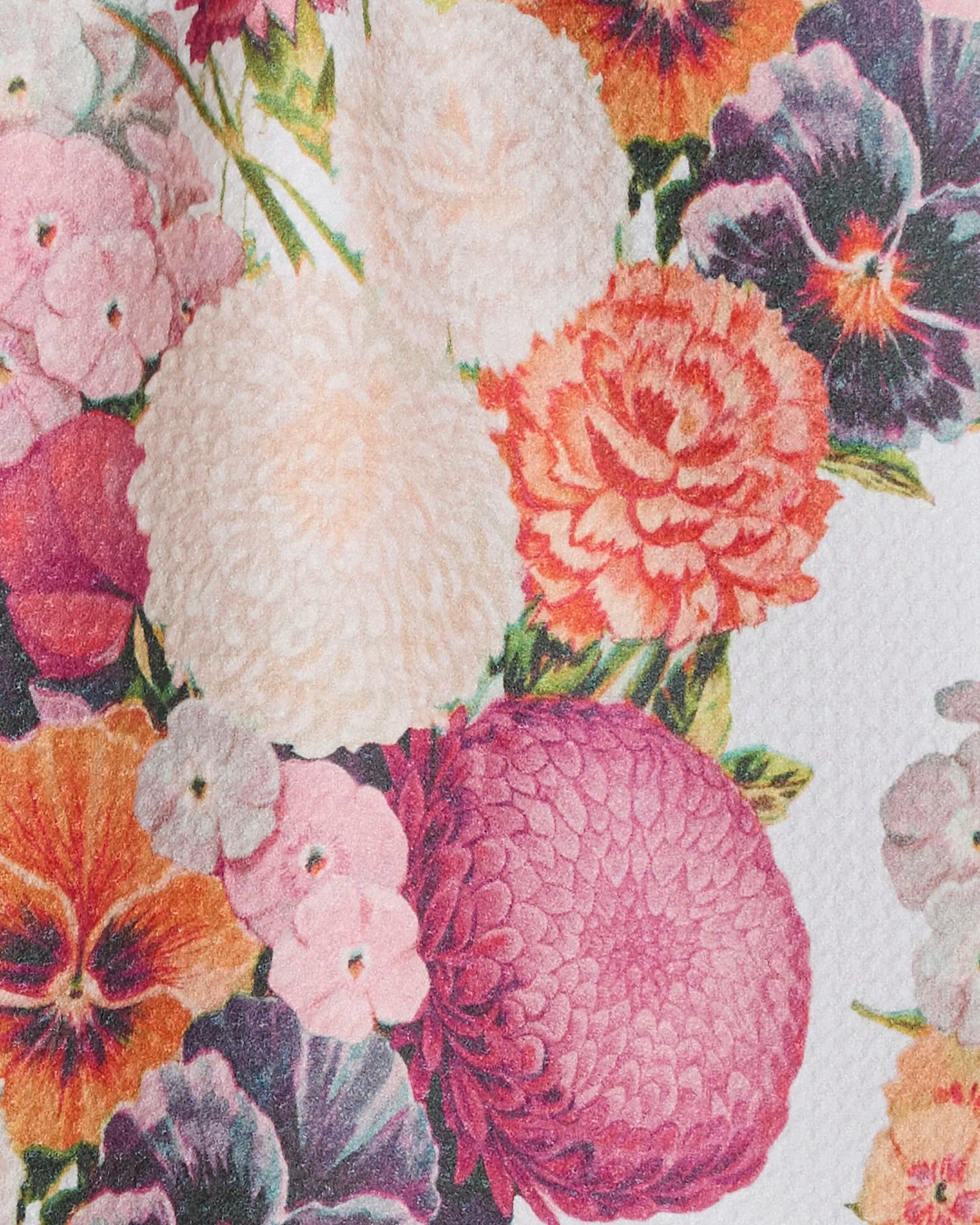 Ecstatic Blooms by Geometry showcases large pink, orange, purple, and cream flowers on textured white—an ultra-absorbent towel made from recycled materials.