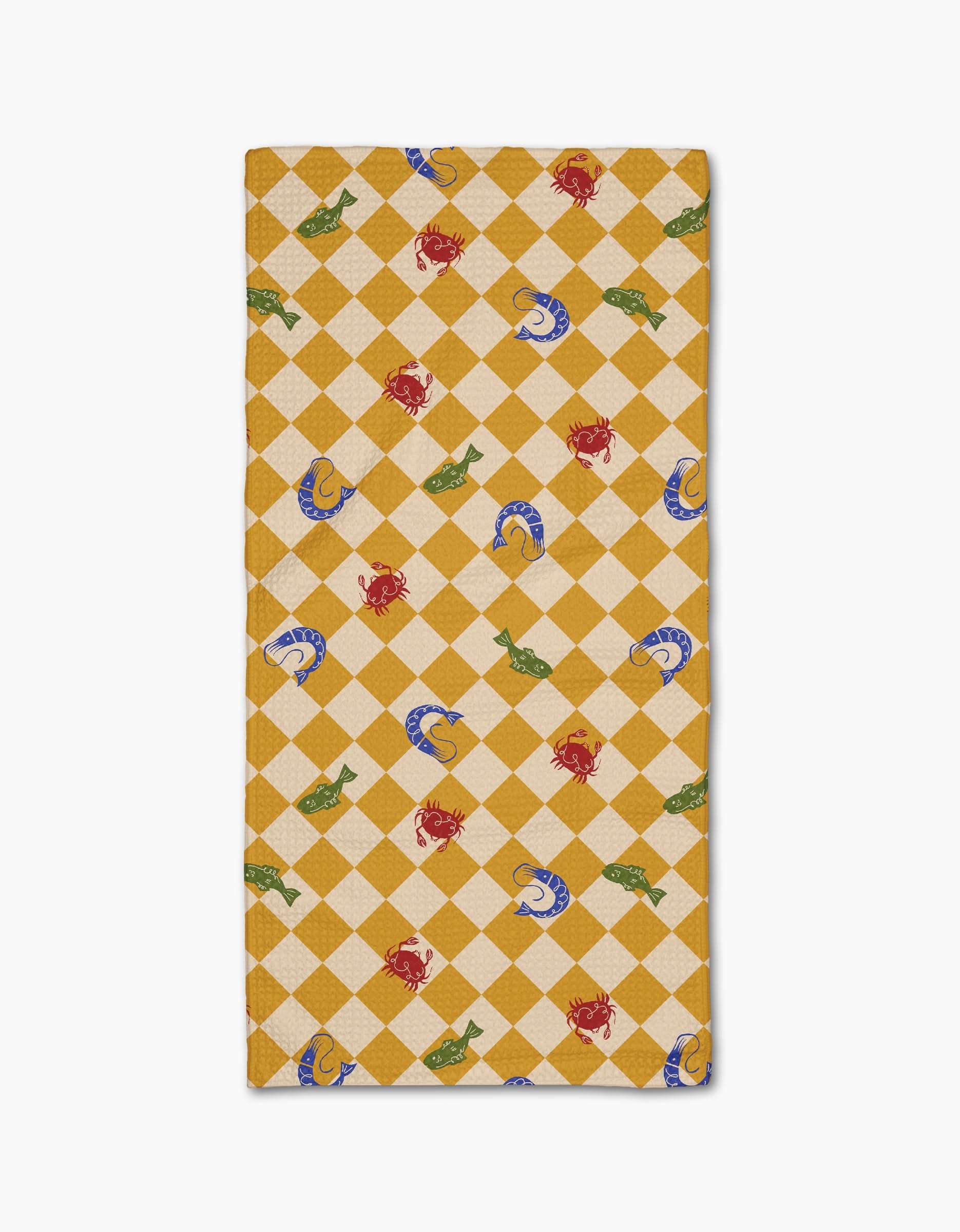 The Geometry El Mar Abierto Bar Towel is rectangular, crafted from Geoweave fabric, and features a beige and yellow checkered design with red crabs, green fish, and blue seashells.