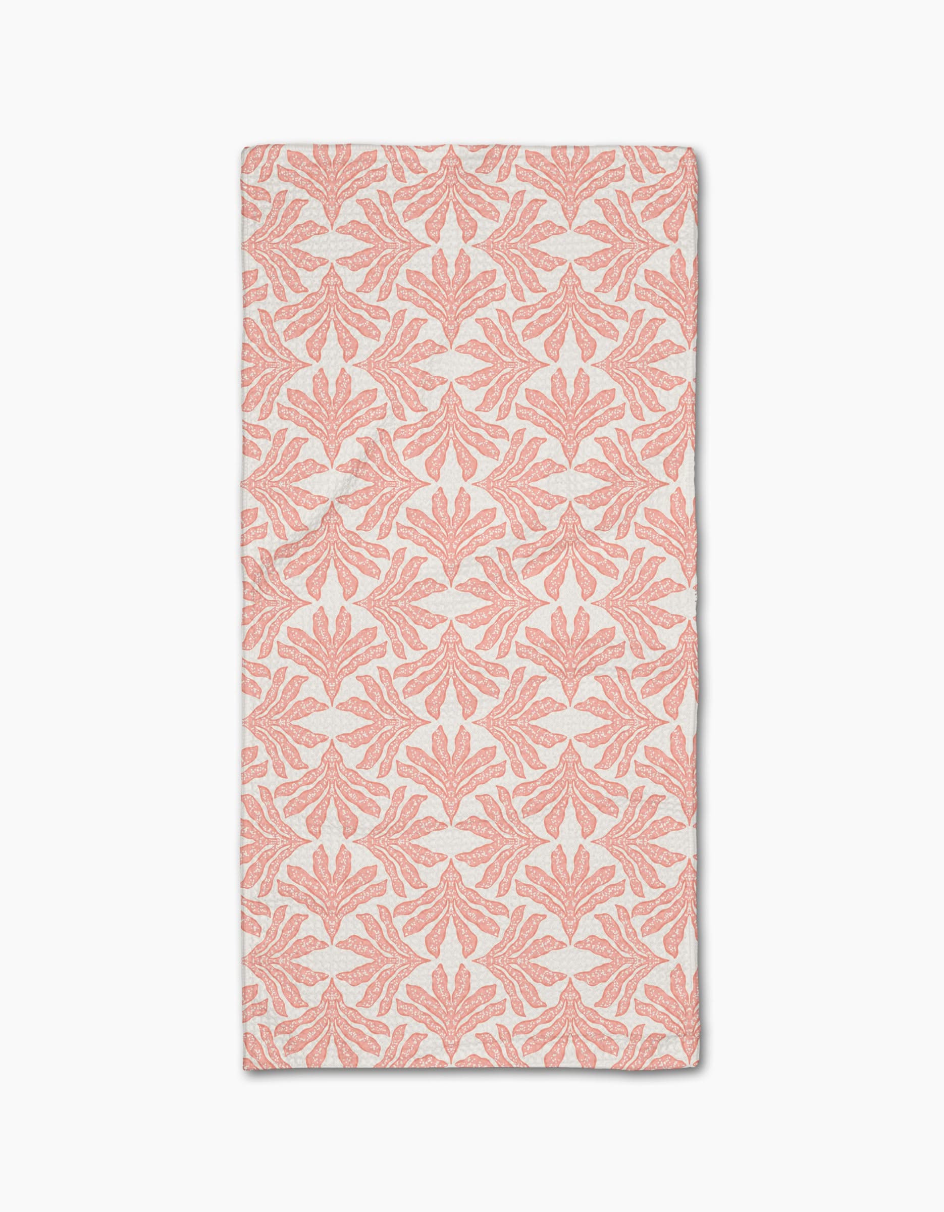 The Ethereal Seaweeds in Blush by Jasmine Blooms Designs is a rectangular white cloth with coral pink, symmetrical seaweed motifs made from recycled materials for a classic, elegant look. Shown flat against a white background.