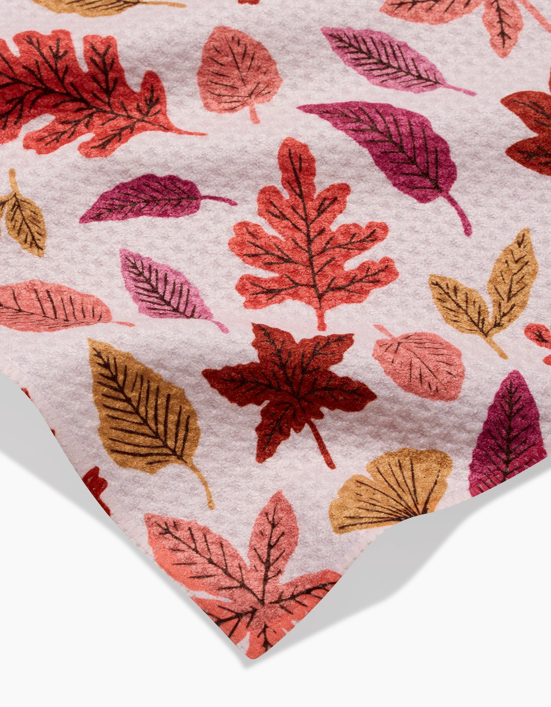 The Kayla Ann Fall Leaves Bar Towel displays a close-up of Geoweave fabric with an autumn leaf pattern in red, orange, yellow, and pink on a light background.