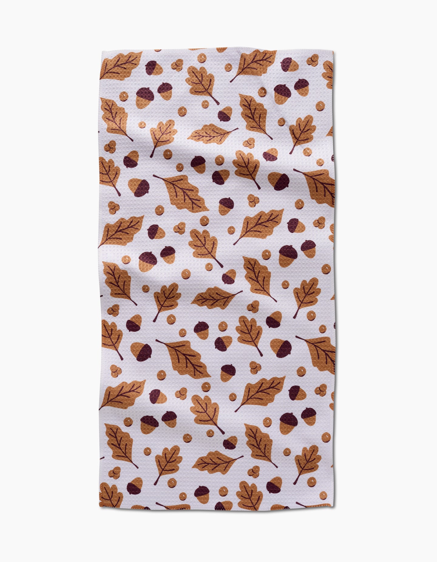 The Falling For Fall napkin by Charlie Rowan Designs is a white, quick-drying towel featuring brown autumn leaves, acorns, and dots in brown and gold.