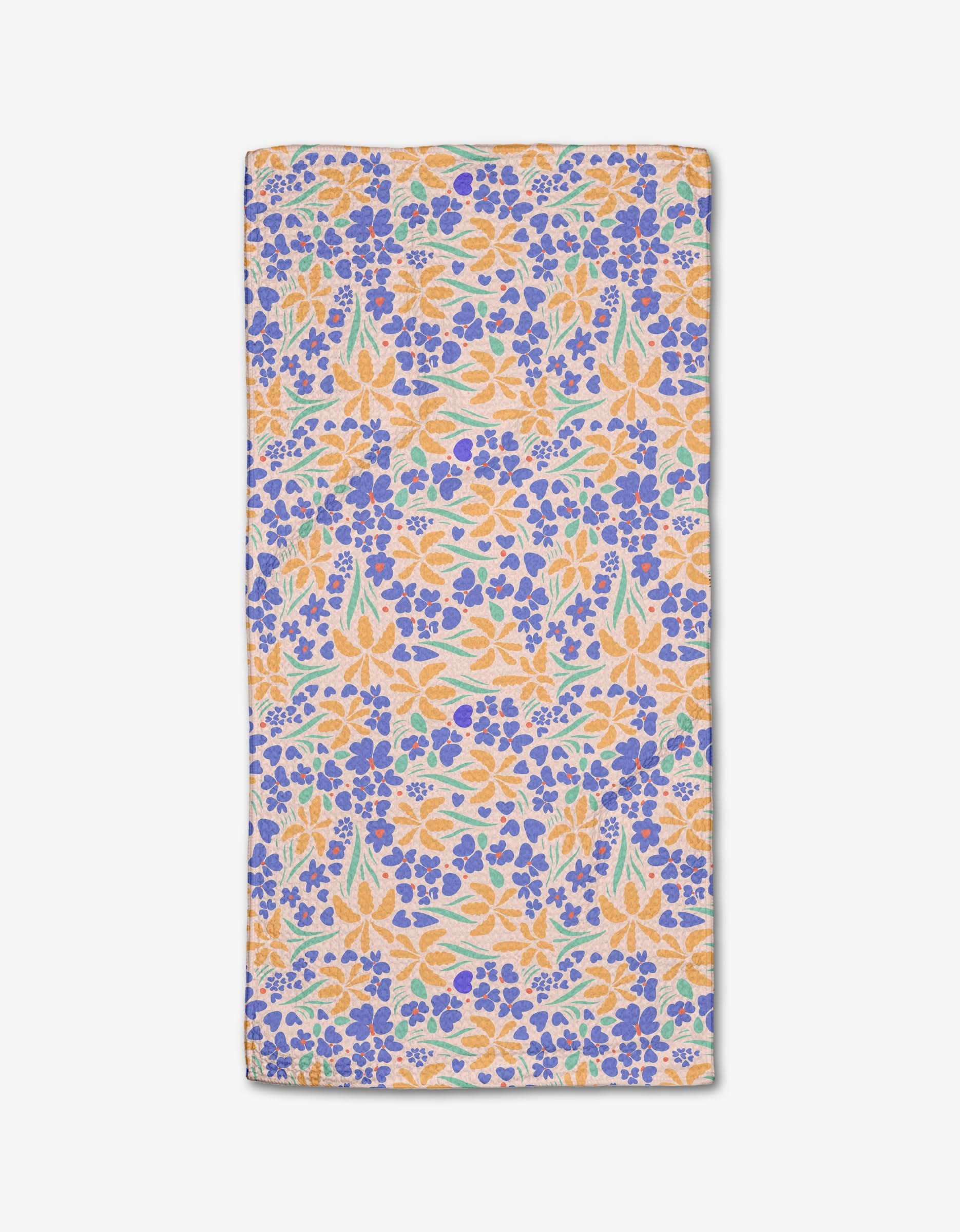 The February bar towel by Elisabeth Wing features a vibrant floral pattern with orange, yellow, blue, and green flowers on white Geoweave fabric for superior absorbency.