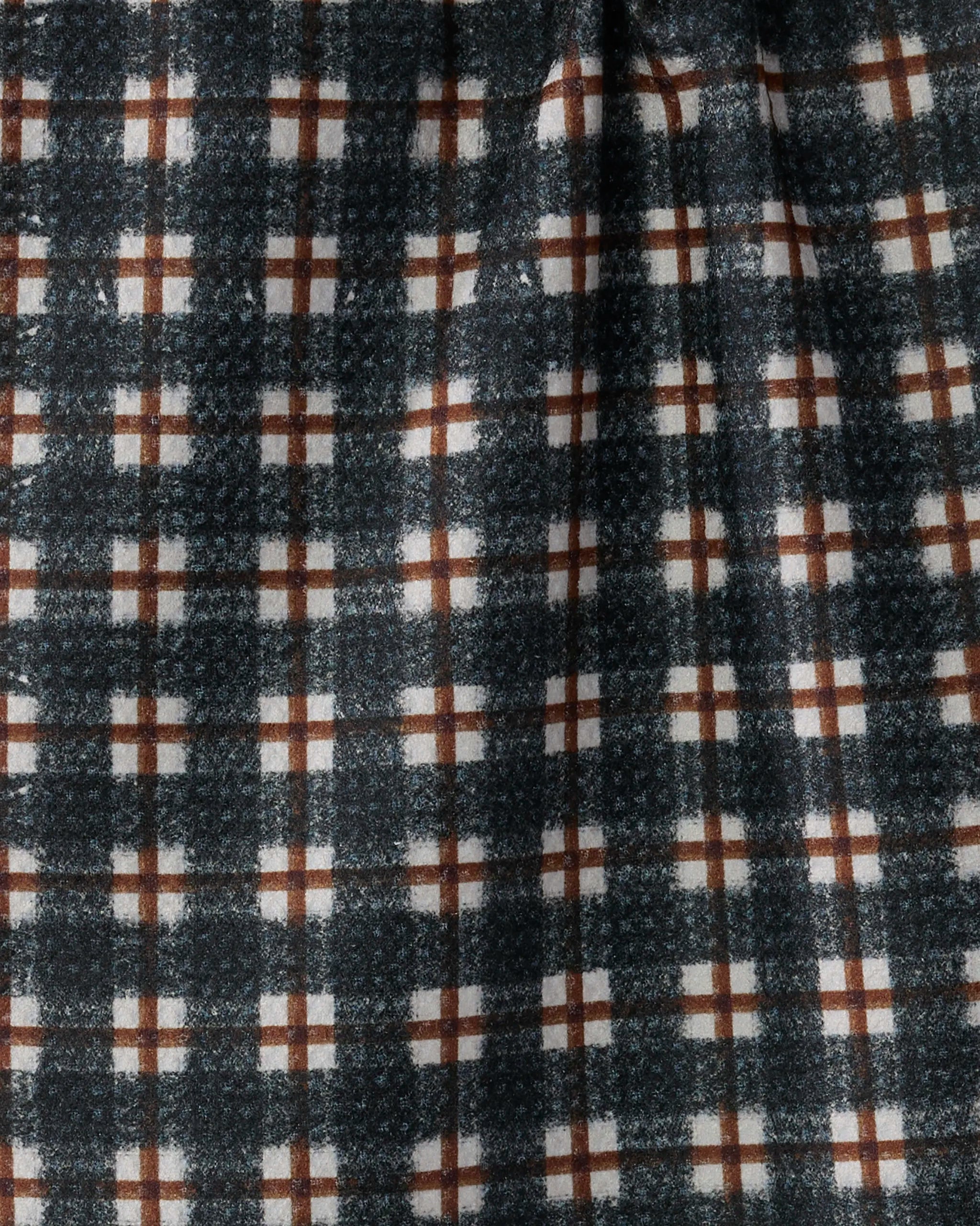 Close-up of the Geometry Flint bar towel, featuring a black, white, and brown plaid grid. Made from soft Geoweave fabric with a slightly fuzzy texture and visible folds.