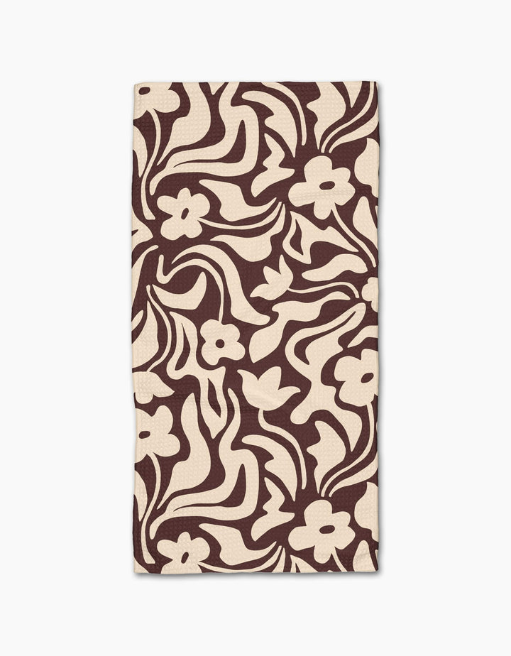 Floral Reverie by Gerdadzy is a beige rectangular cloth napkin with an abstract dark brown floral pattern of stylized flowers and wavy leaves, crafted from recycled materials for an eco-friendly touch.