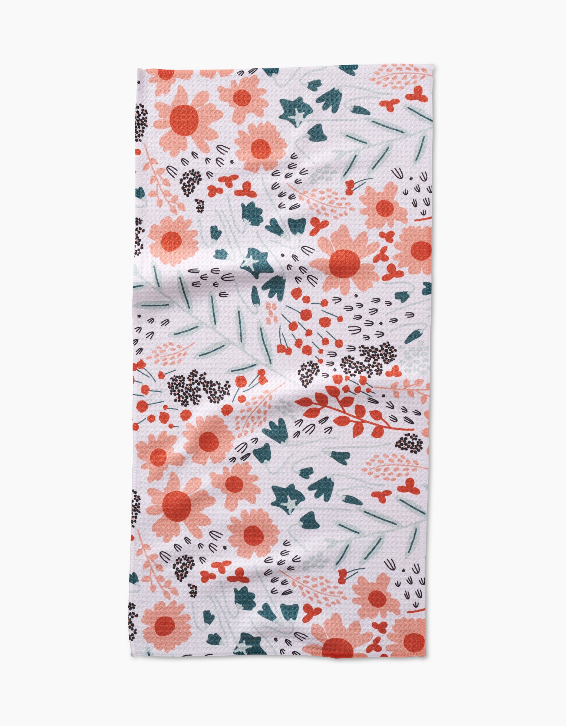 The Coit Creative Forest Foliage Bar Towel features orange, red, and dark teal floral patterns on white Geoweave fabric, with a slightly wrinkled look.