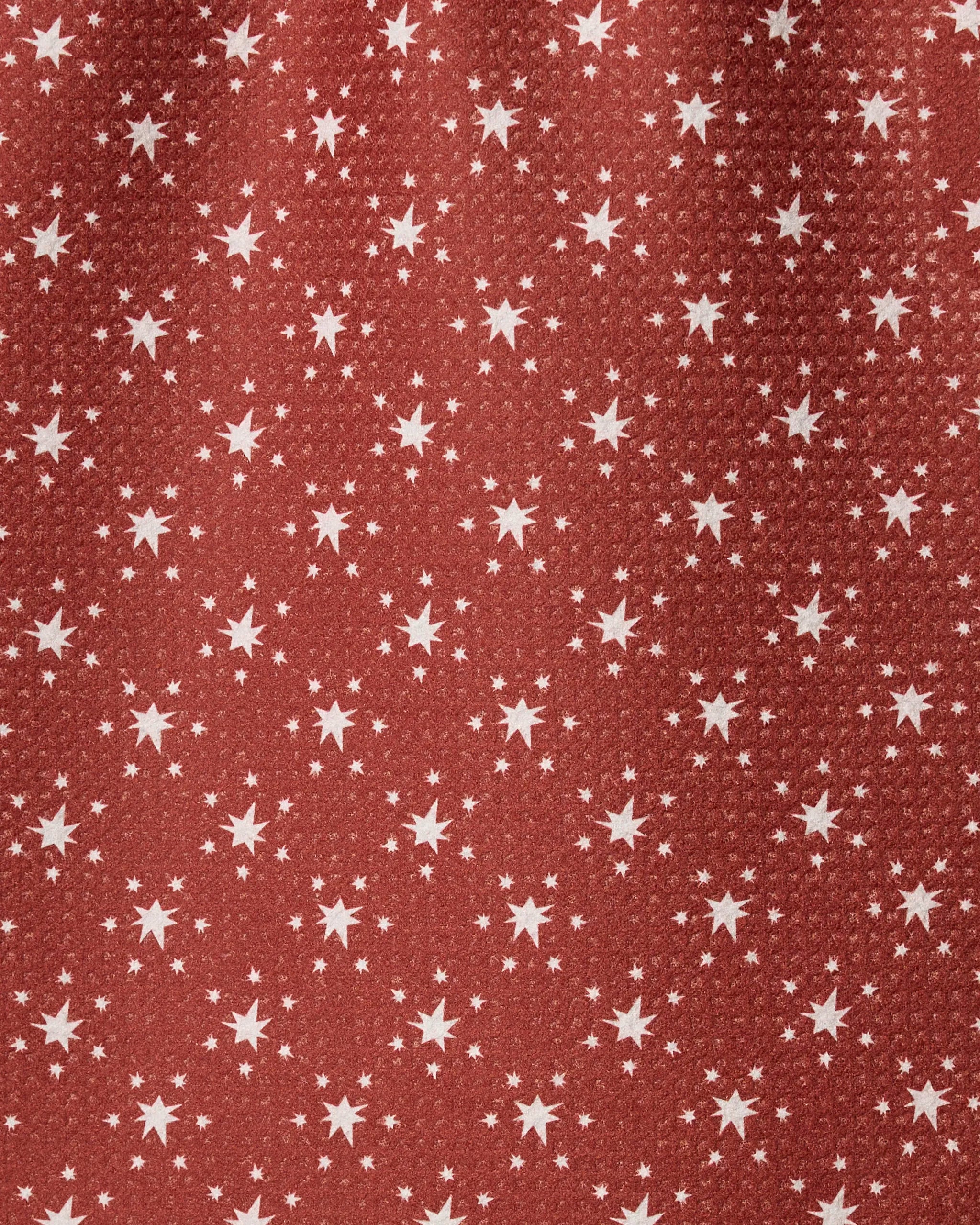 Geometry’s Freedom Red towel is quick-drying and features a red background with evenly spaced white stars in various sizes.