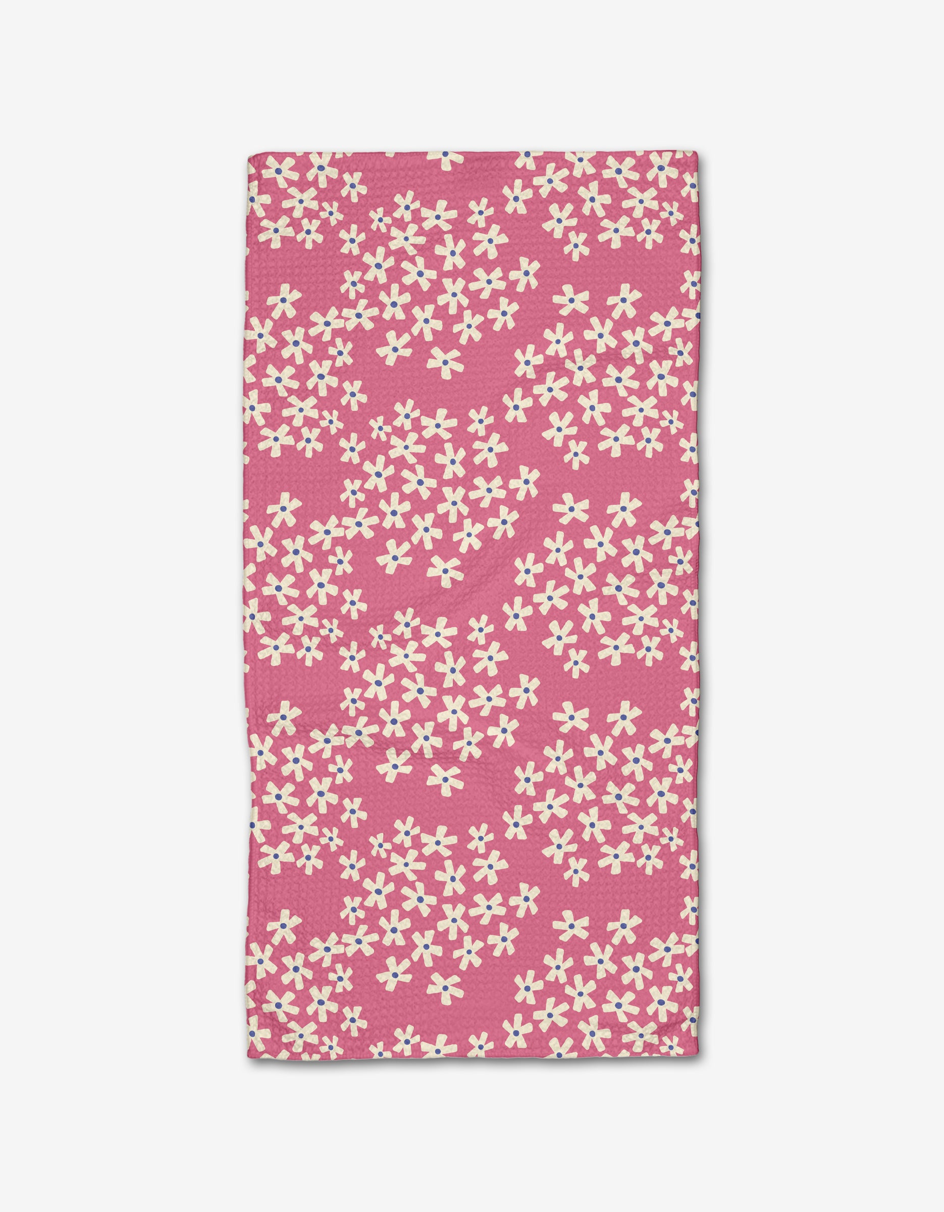 Lizzie Clark’s Geranium towel is a rectangular pink bar towel with scattered small white flowers, made from soft Geoweave fabric and shown flat on a white background.