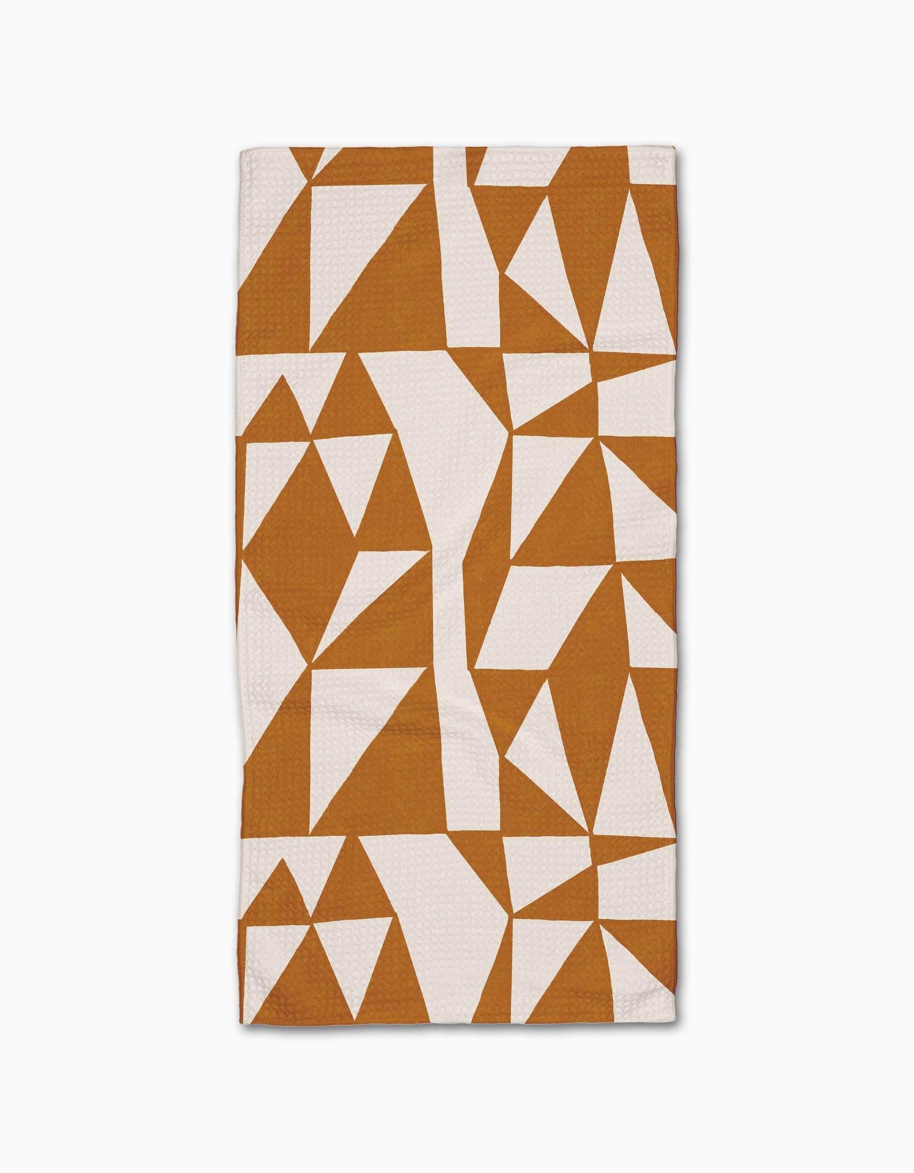 The Golden Angles bar towel by Lisa Nelson features an abstract geometric pattern of white and brown angular shapes in a modern, fragmented design on a white Geoweave fabric.