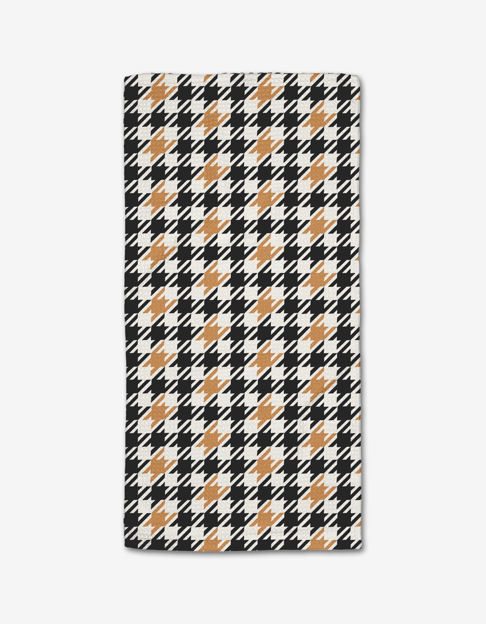 The Golden Houndstooth Bar Towel by Hufton Studio features a classic black and white houndstooth design with orange grid accents, crafted from soft Geoweave fabric on a white background.