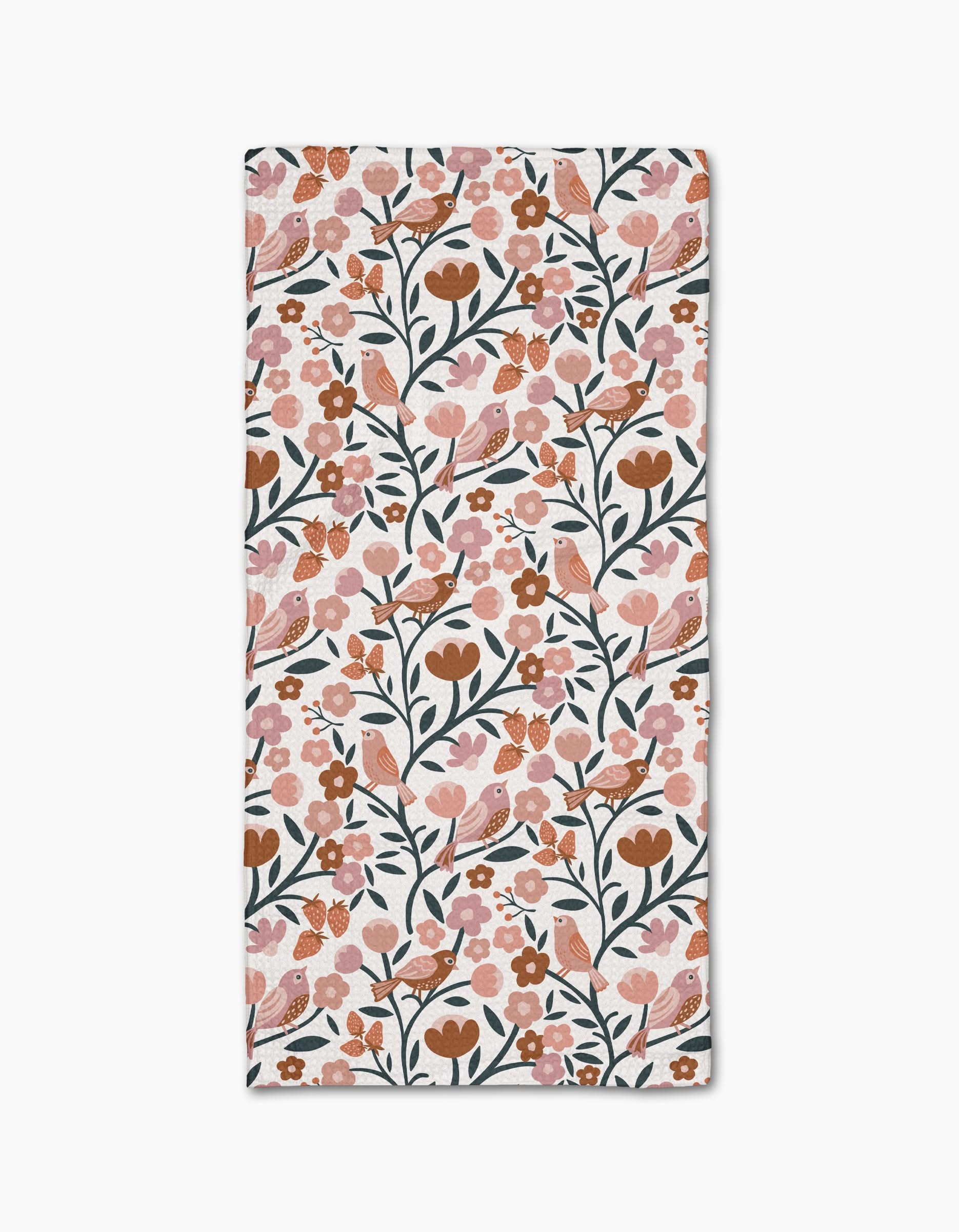 The Golden Hour Park Lane bar towel by Charlie Rowan Designs features a rectangular shape with a repeating pattern of pink, orange, and brown flowers, green stems and leaves, birds, and berries on white Geoweave fabric made from recycled materials.