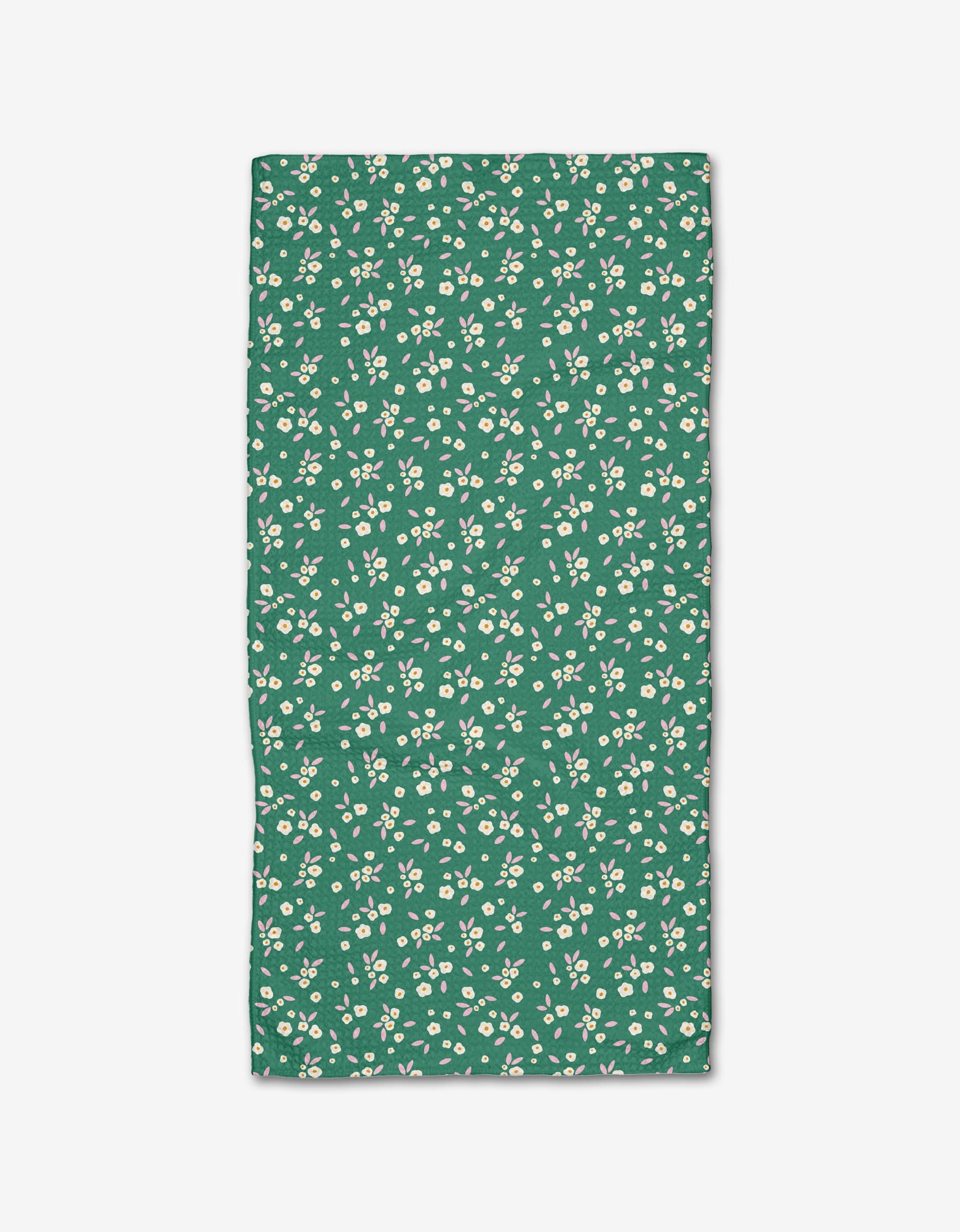 The Green Field of Flowers by Megan Roy is a rectangular Geoweave fabric with an ultra-absorbent surface, featuring small white flowers and light green leaves evenly spread across a green background.