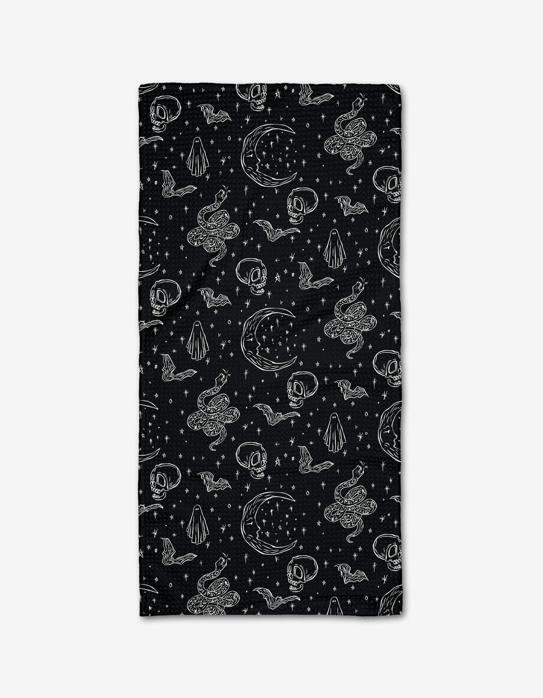 The Halloween Hauntings Bar Towel by Aubrey Fairchild features a black rectangular design with white snakes, moons, stars, pyramids, and eyes in a mystical pattern on ultra-absorbent Geoweave fabric.