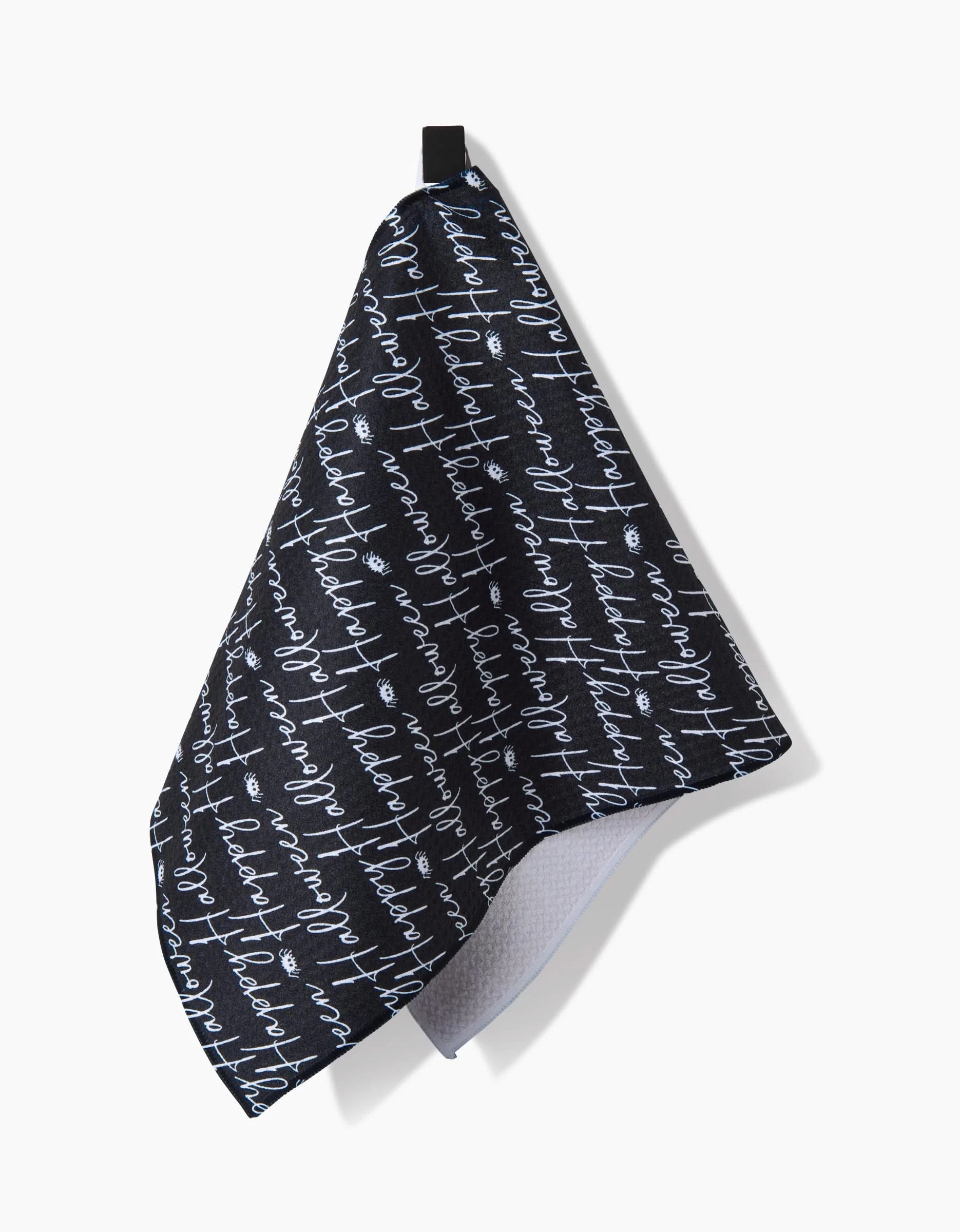 The Geometry Halloween Script Black bar towel features white handwritten-style script on a black background, offering both decorative flair and ultra-absorbent functionality for your space.