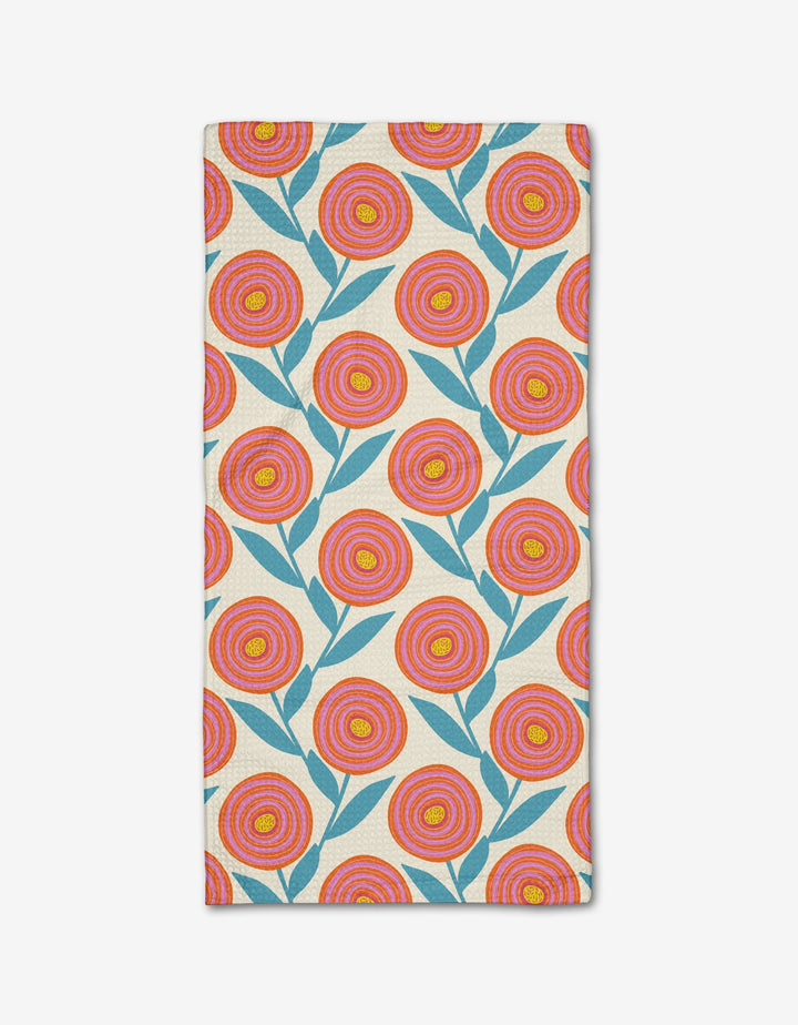 The Happy Ranunculus Bar Towel by Lizzie Clark features a repeating pattern of red, orange, and yellow flowers with blue leaves on beige Geoweave fabric.