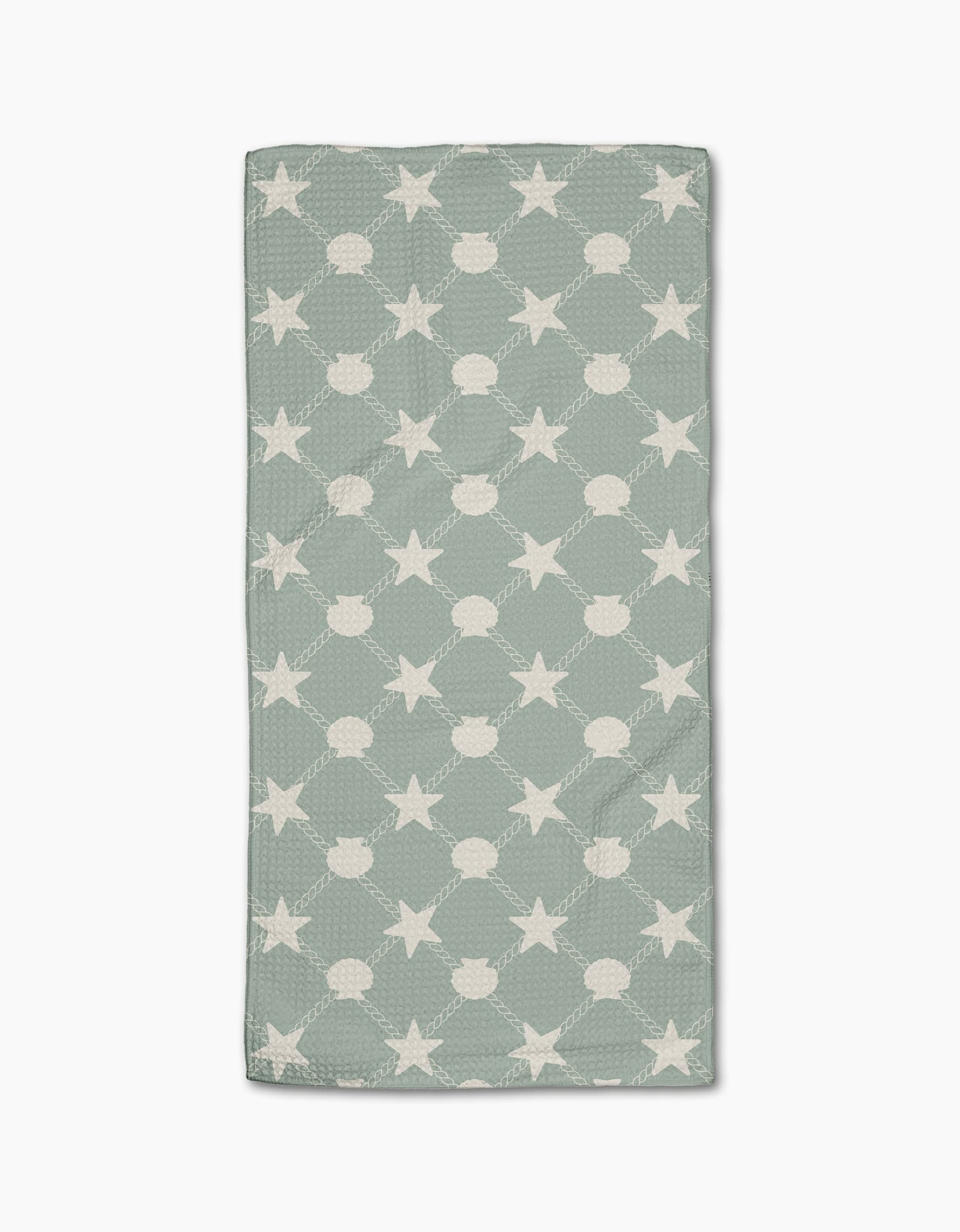 The Geometry Harbor Haven is a rectangular, light green bar towel made from recycled materials, featuring repeating white stars connected by dotted lines, shown on a white background.