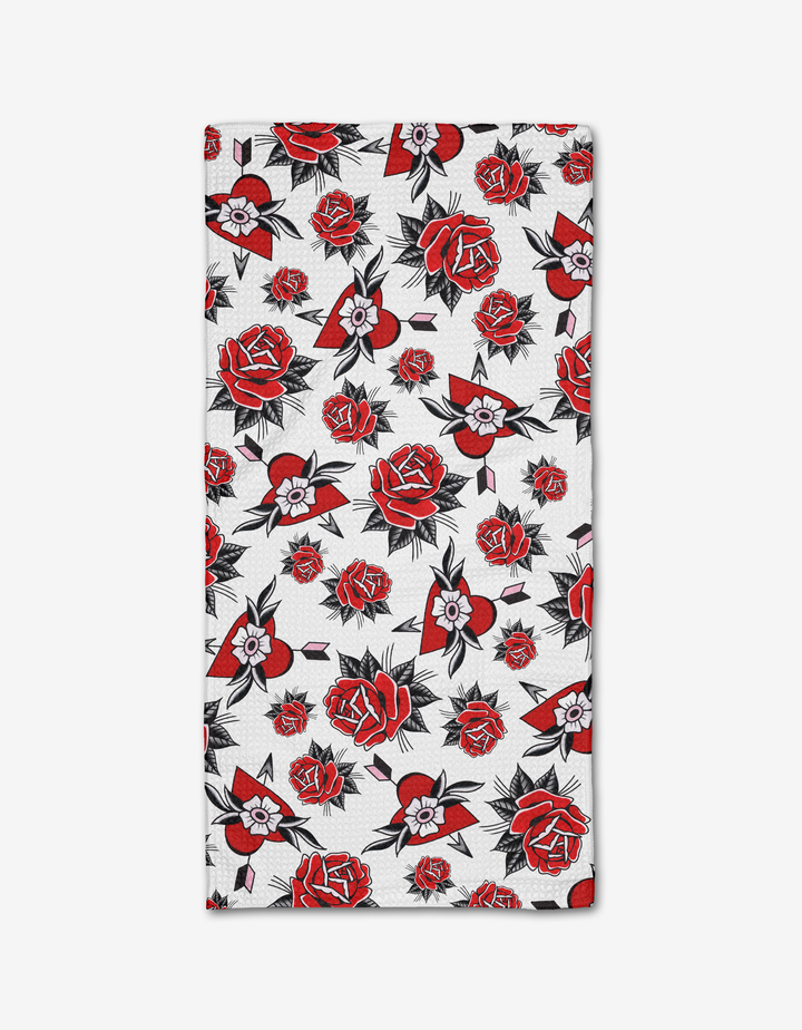 The Hearts and Roses Bar Towel by Cole Strem features a rectangular white design with red and black roses plus small flowers and leaves, evenly spread across ultra-absorbent Geoweave fabric.