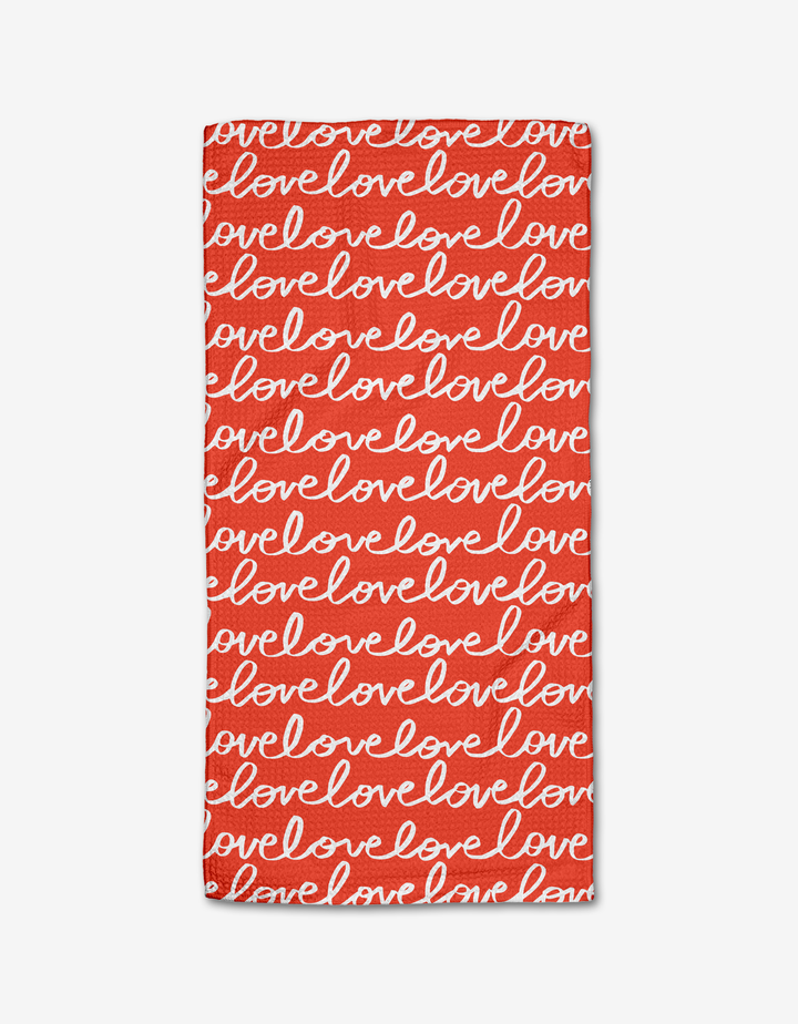 The Infinite Love Bar Towel by Kayla Ann features a bold red rectangular design with love in white cursive across Geoweave fabric, creating a cheerful and romantic pattern.