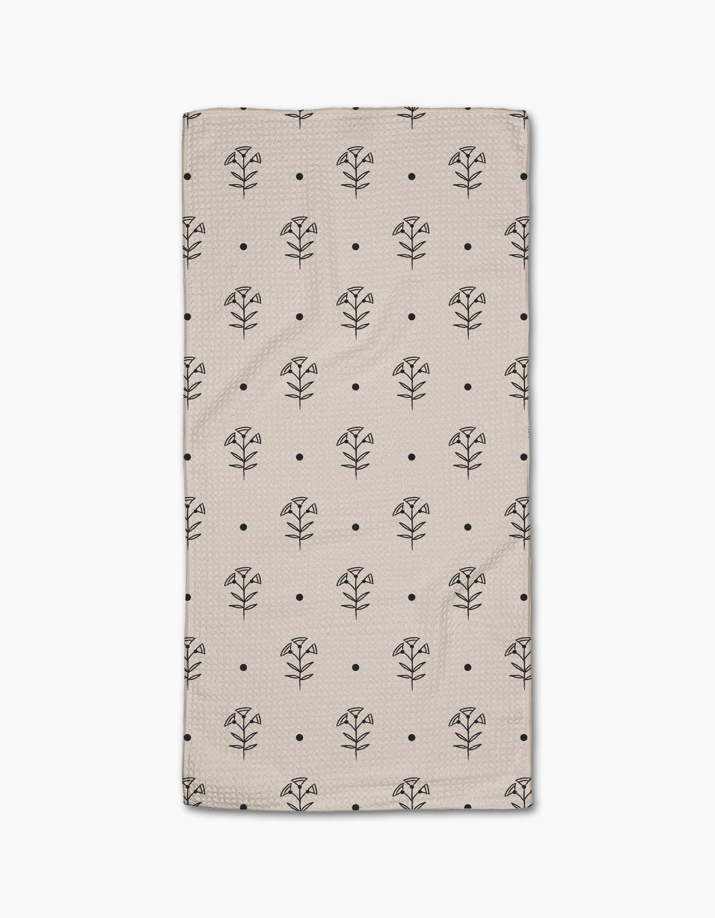 The Cole Strem Inked Bloom Bar Towel is beige and rectangular, featuring a grid of black line-drawn flowers and dots. Crafted from Geoweave fabric, it offers exceptional durability and absorbency.