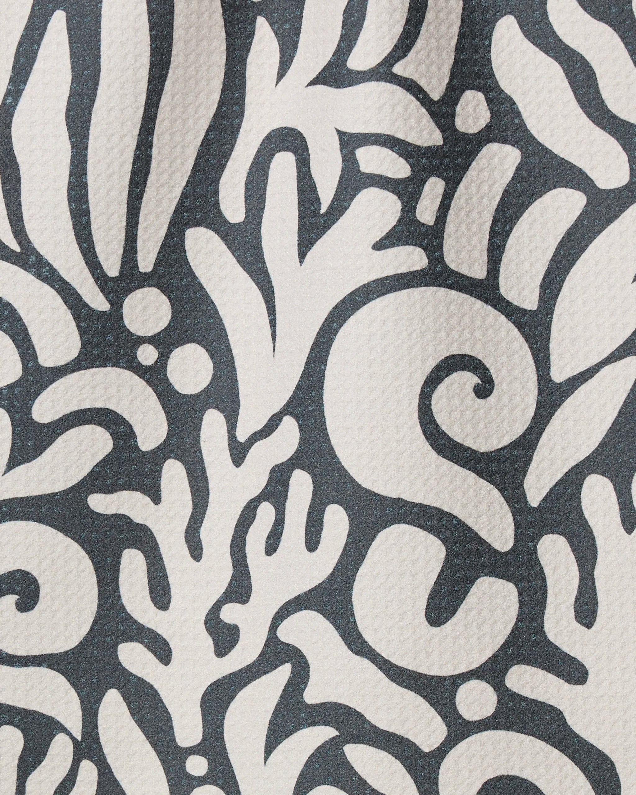 Inkwell Reef by Geometry features abstract black and white, plant-inspired swirls on textured recycled fabric—an artistic kitchen towel that adds flair and sustainability to your home.