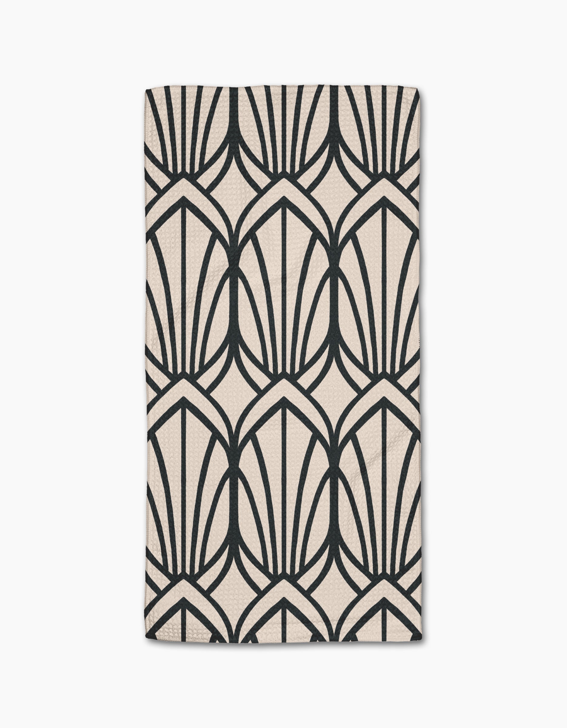 The Amy MacCready Jocelyn bar towel is beige, rectangular, made from Geoweave fabric, and features a bold black geometric pattern of stylized fan shapes or arches.