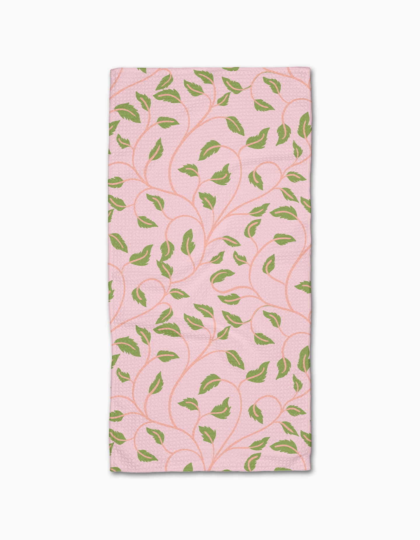 Leafy Maze by Jasmine Blooms Designs: a rectangular pink bar towel crafted from recycled materials, adorned with green leaves and curving vines.