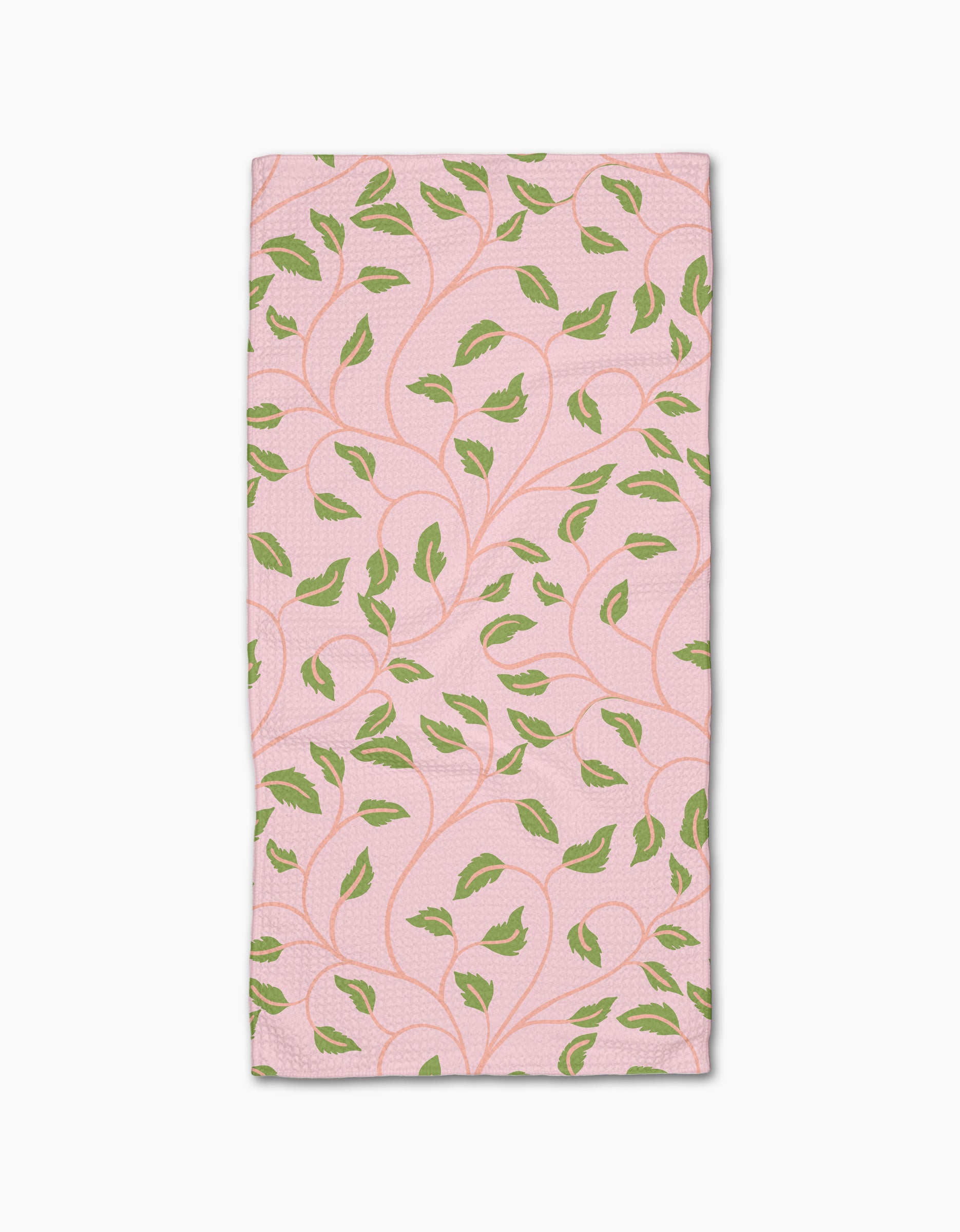 Leafy Maze by Jasmine Blooms Designs: a rectangular pink bar towel crafted from recycled materials, adorned with green leaves and curving vines.