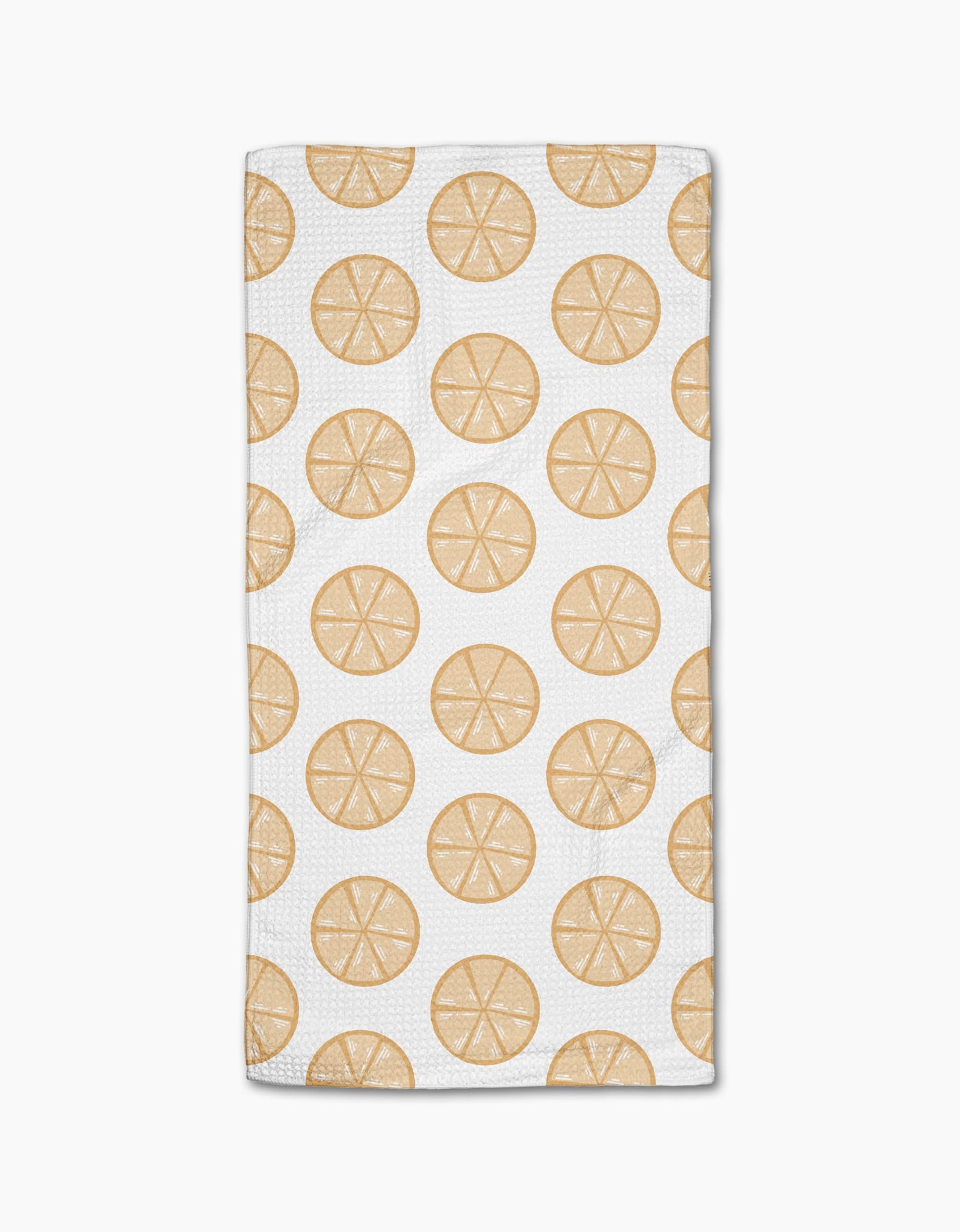 Lemon Doodles by Letters By Shells is a white rectangular, ultra-absorbent towel with a repeating pattern of lemon slice illustrations evenly spaced across the surface.