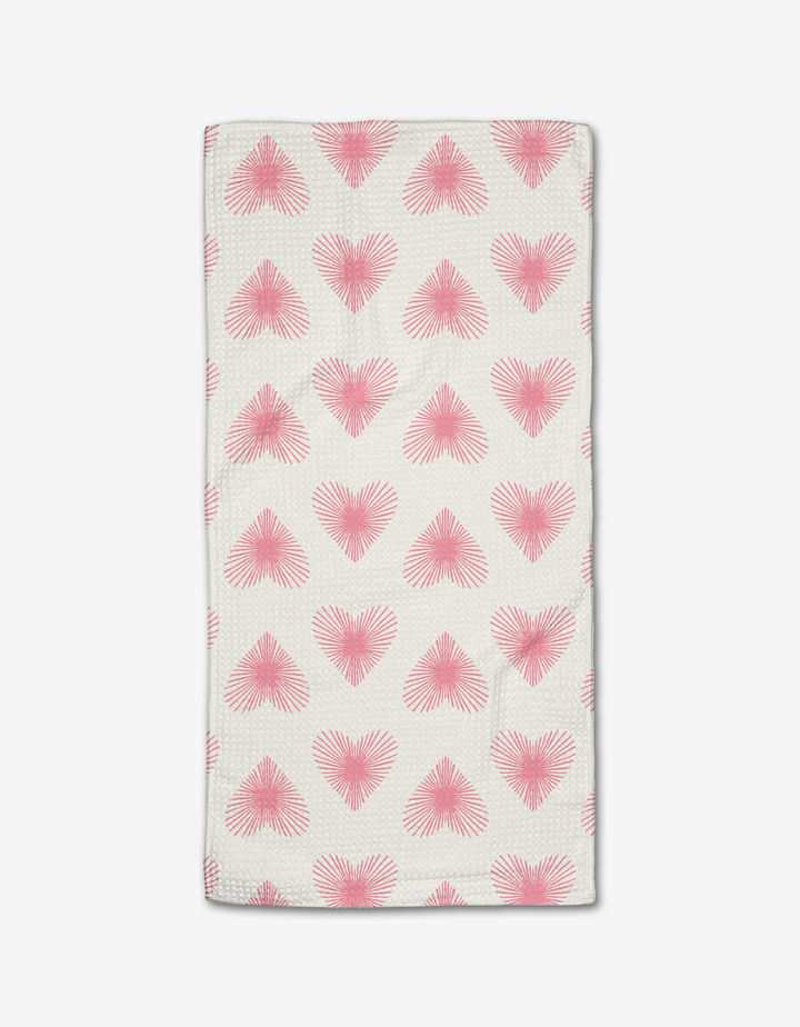 The Life Line Hearts bar towel by Hufton Studio is a white rectangular towel with neat rows of pink heart shapes, made from soft Geoweave fabric.