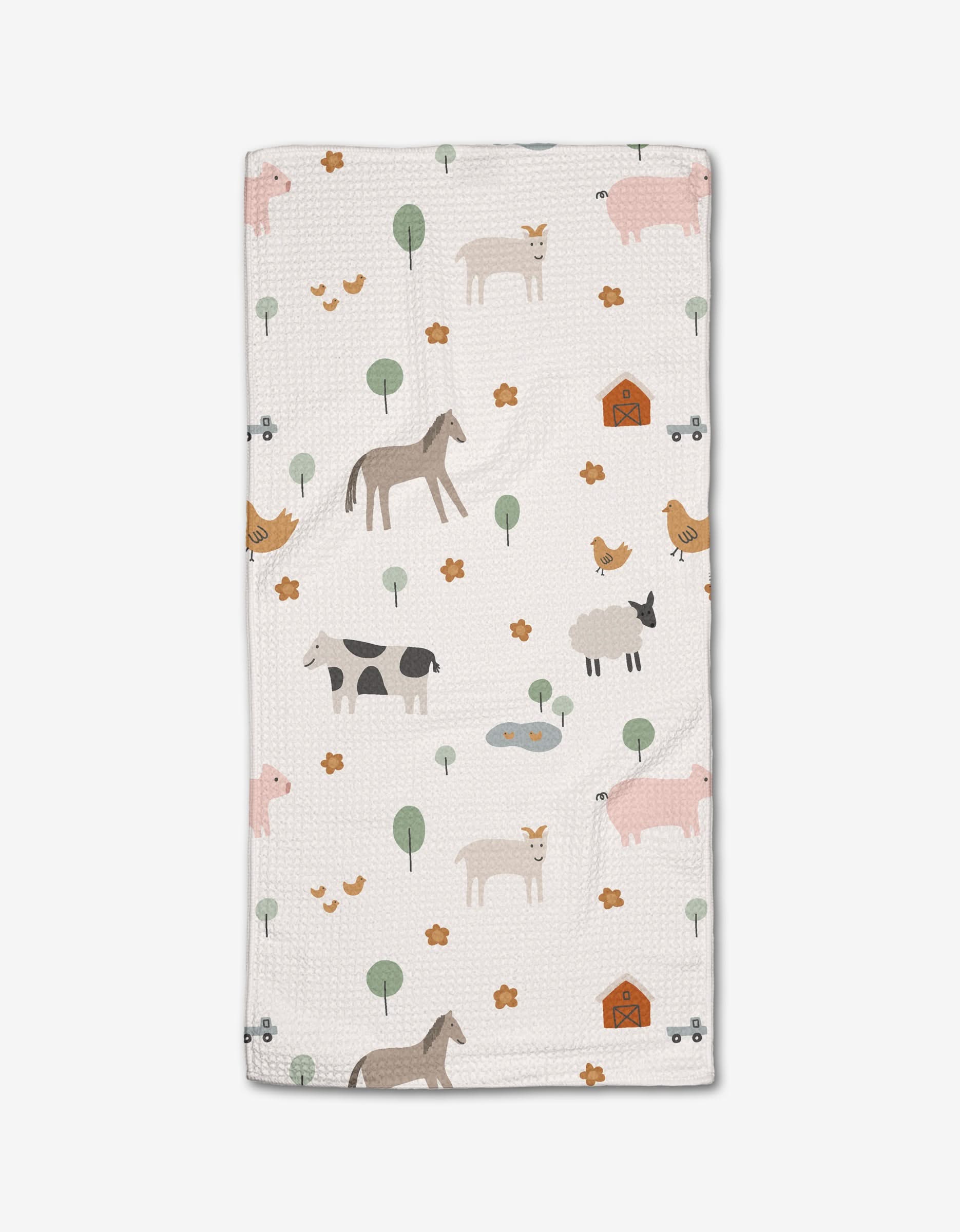 The Coit Creative Light Farm Animals baby blanket is made from ultra-absorbent Geoweave fabric and features a soft, earthy print of horses, cows, pigs, chickens, ducks, trees, flowers, barns, and ponds.