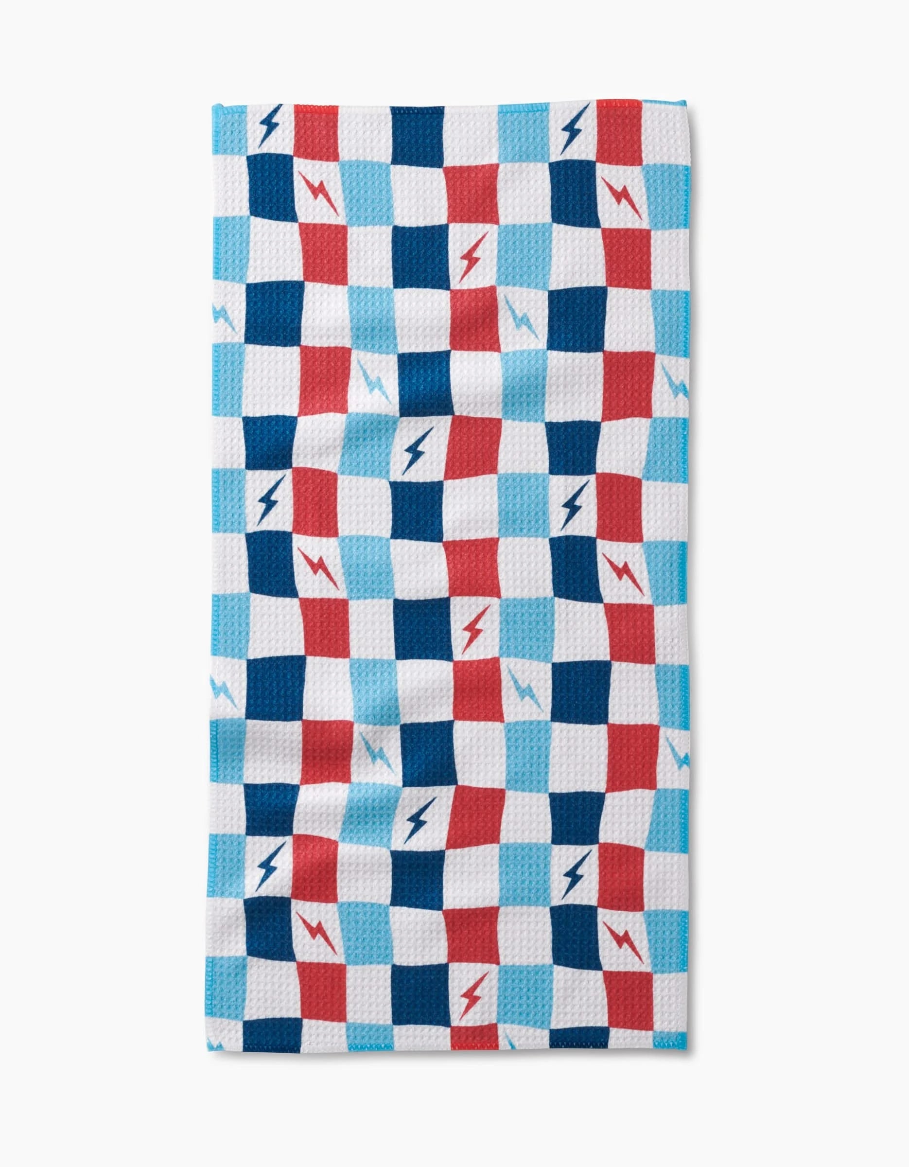 The Lightening Bolt Chess Bar Towel by Hufton Studio features a blue, red, and white checkered design with lightning bolts on Geoweave fabric, shown against a white background.