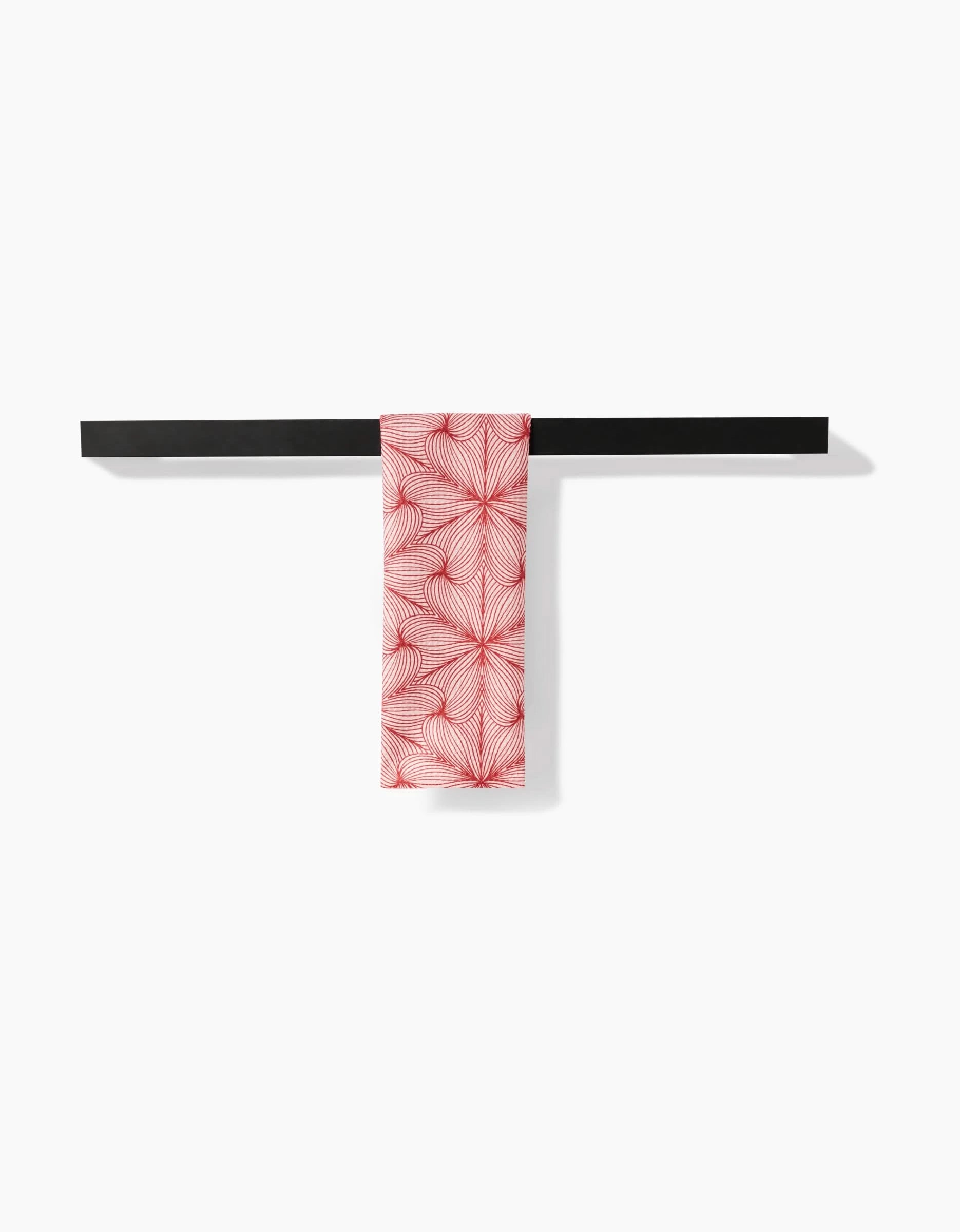 A red and white patterned Marta Harvey Lined bar towel, crafted from durable Geoweave fabric, hangs neatly folded over a horizontal black bar against a plain white background.